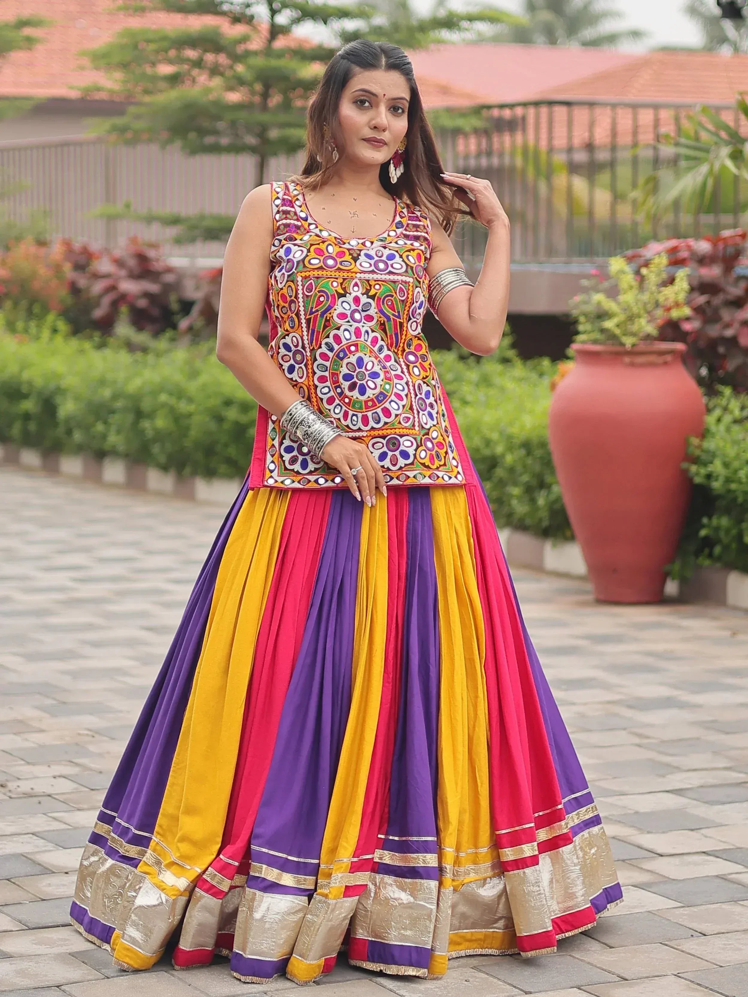 Colorful embroidered Indian lehenga choli with mirror work, perfect for festive occasions and weddings.