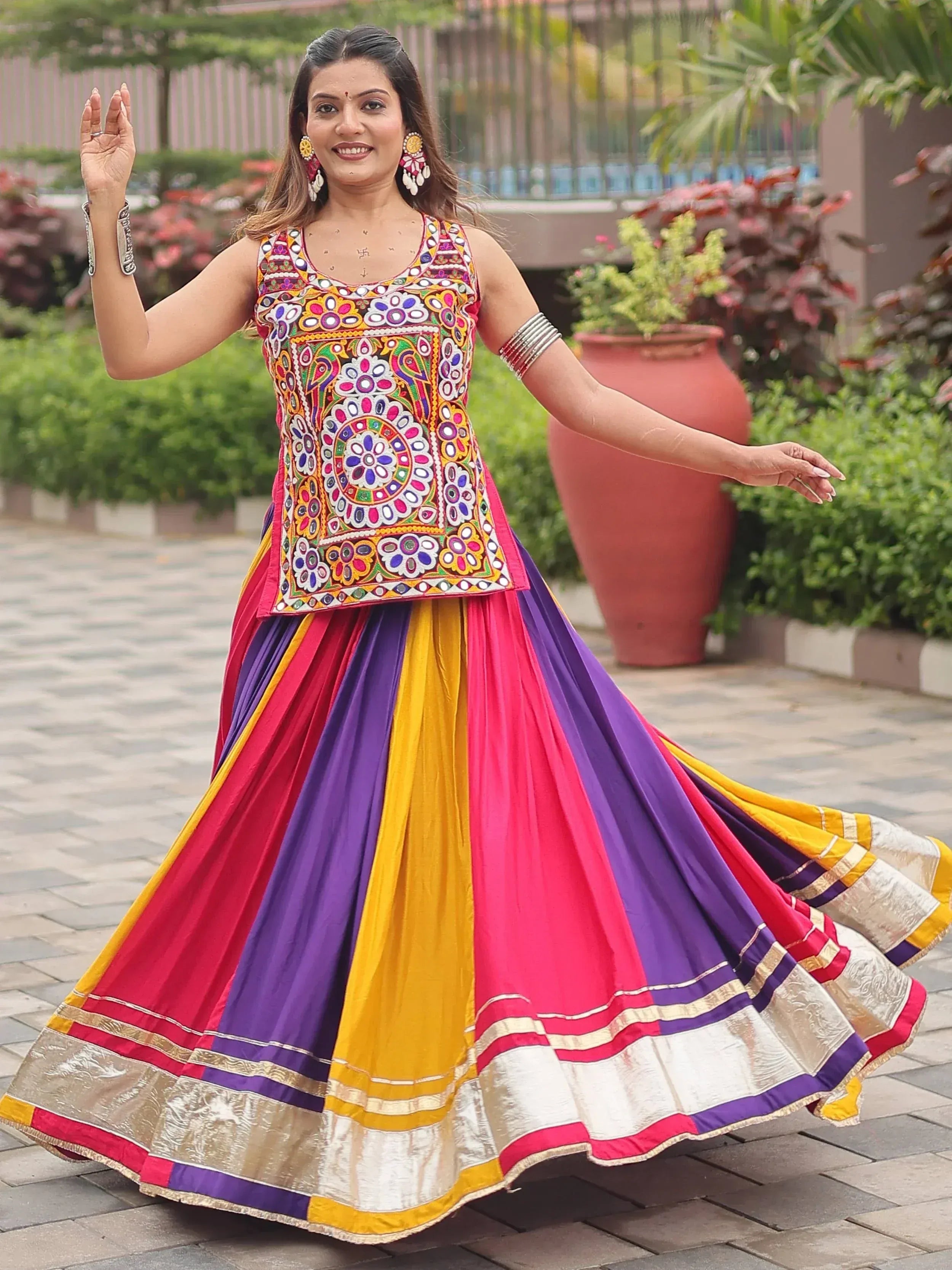 Vibrant multicolor embroidered lehenga choli with floral mirror work, perfect for festive occasions and traditional celebrations.
