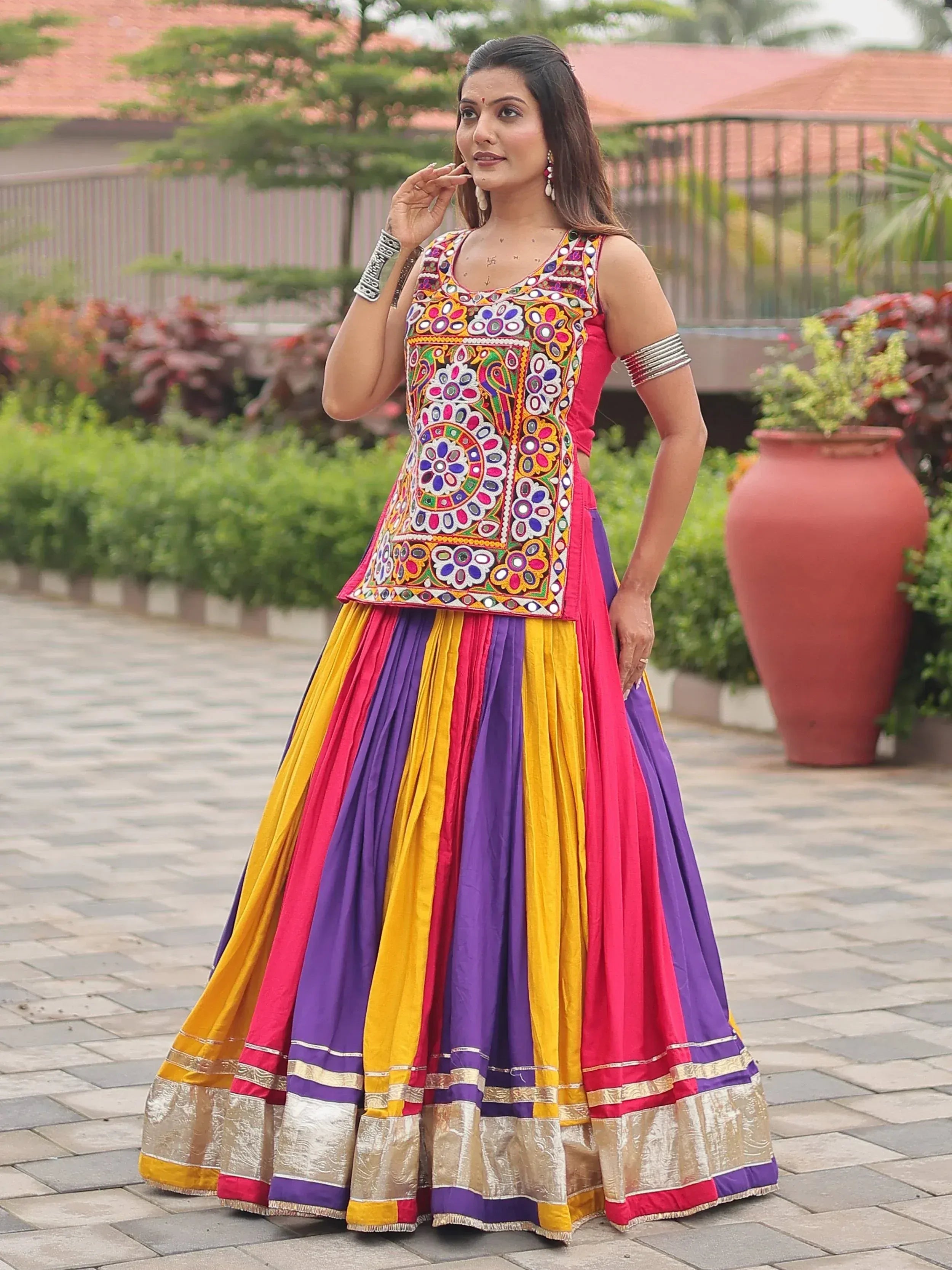 Vibrant multicolor embroidered lehenga choli with floral patterns and pleated skirt for festive occasions