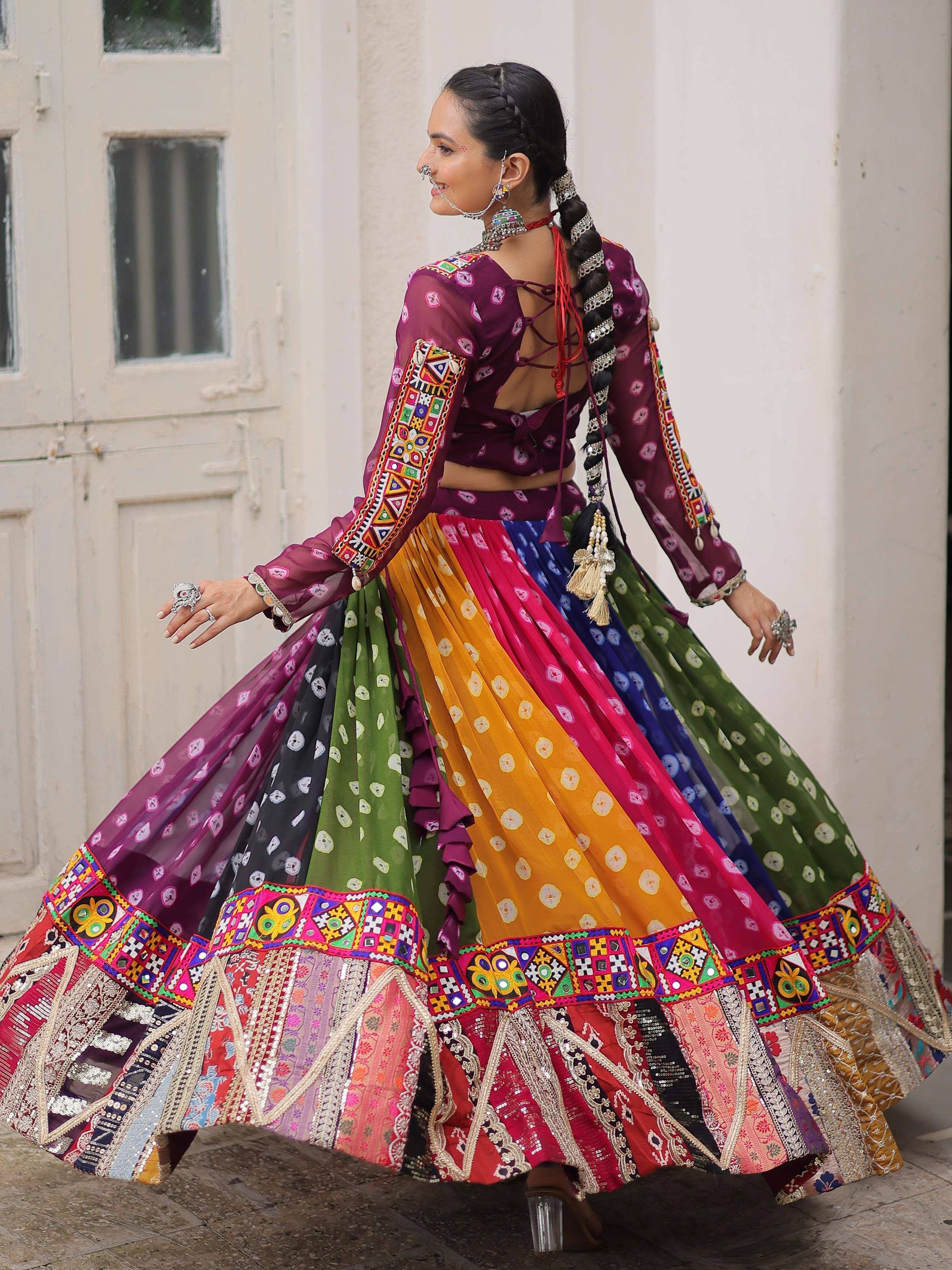 Woman in colorful embroidered Indian lehenga choli with mirror work, perfect for festive occasions.