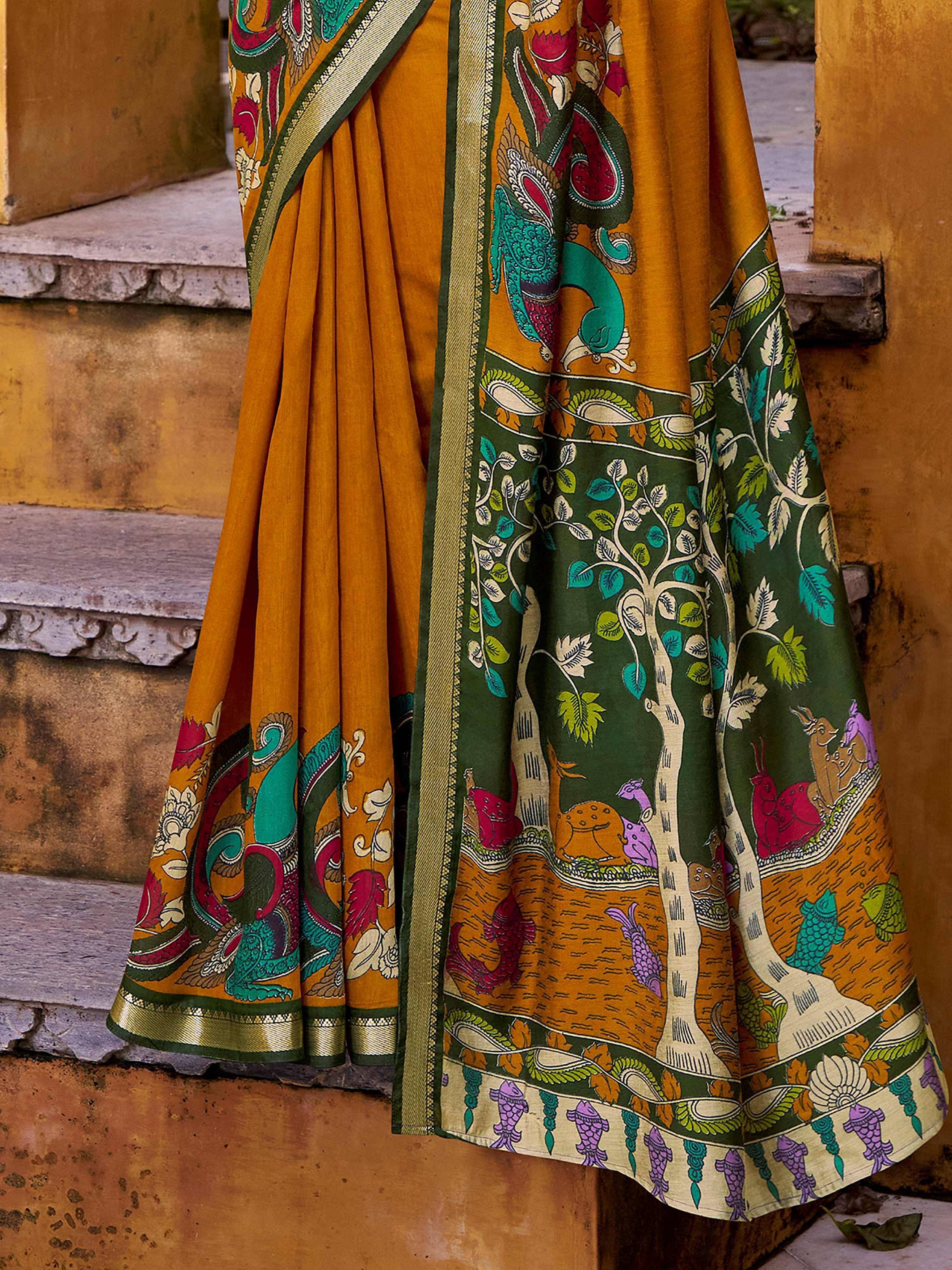 Mustard and green printed saree with peacock, tree, and fish motifs, ideal for ethnic wear