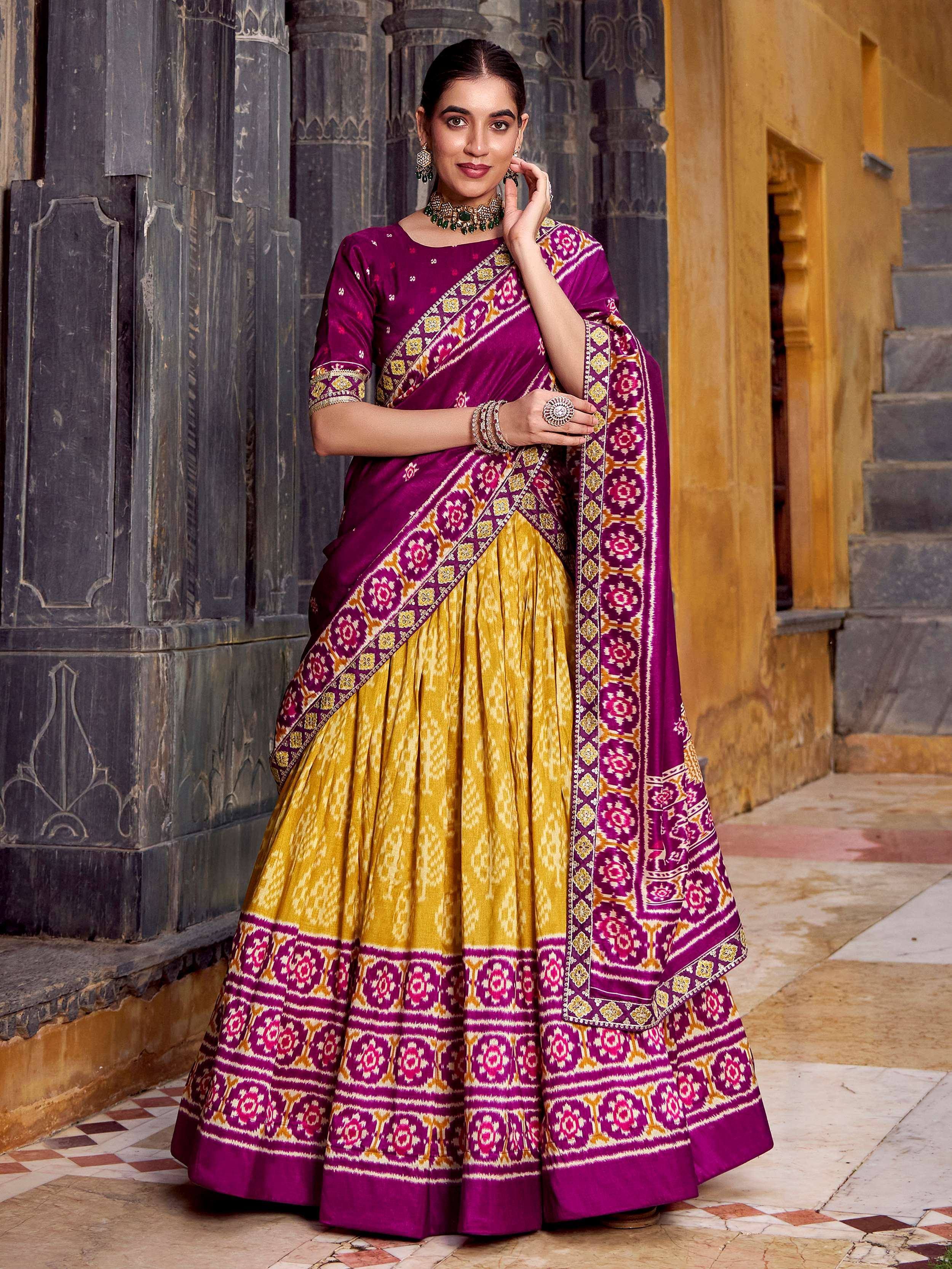 Purple and gold designer lehenga choli with intricate Ikat print, perfect for Indian ethnic wear occasions.