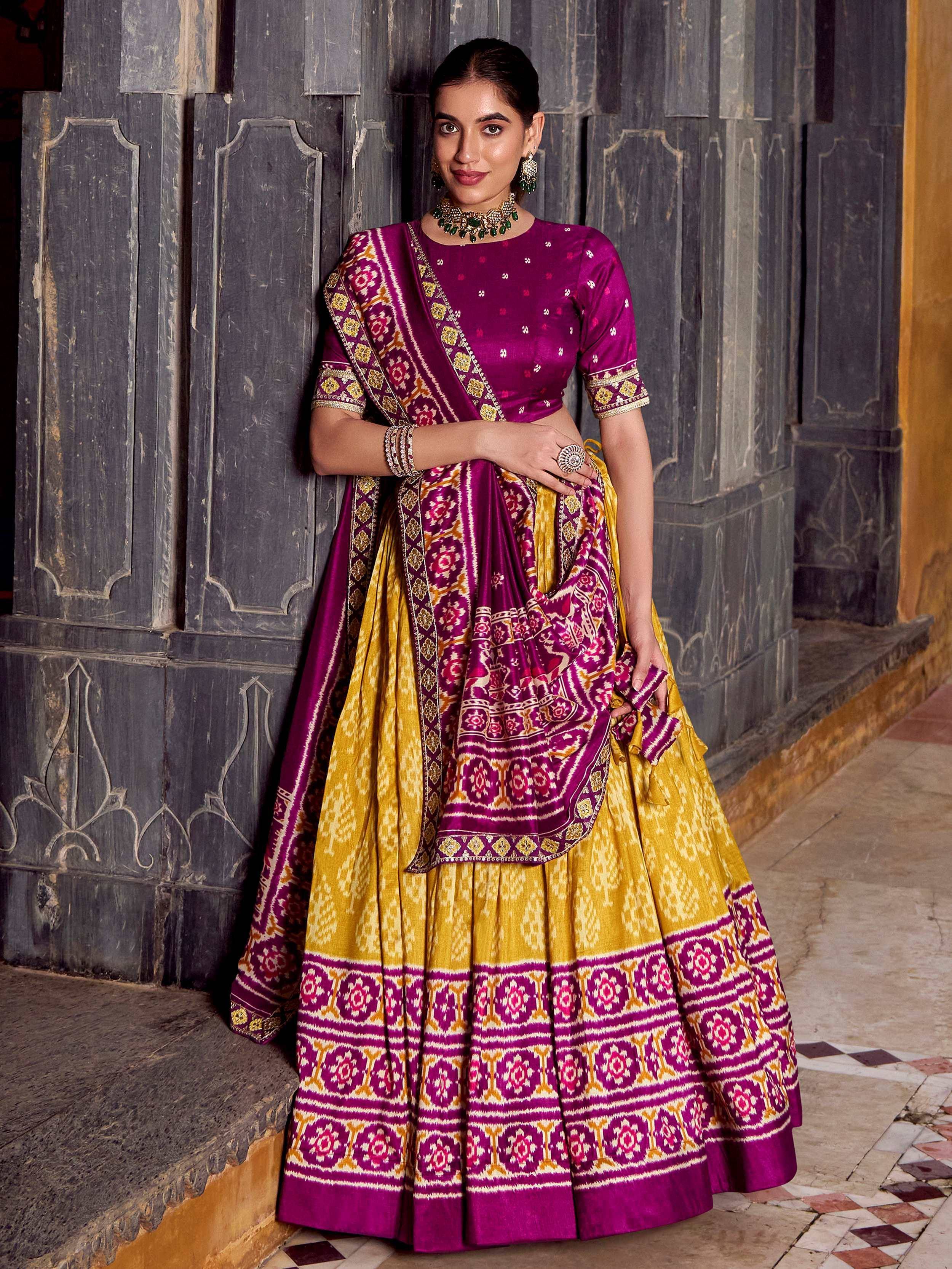 Purple and yellow designer lehenga choli with intricate ikat print, perfect for Indian ethnic wear
