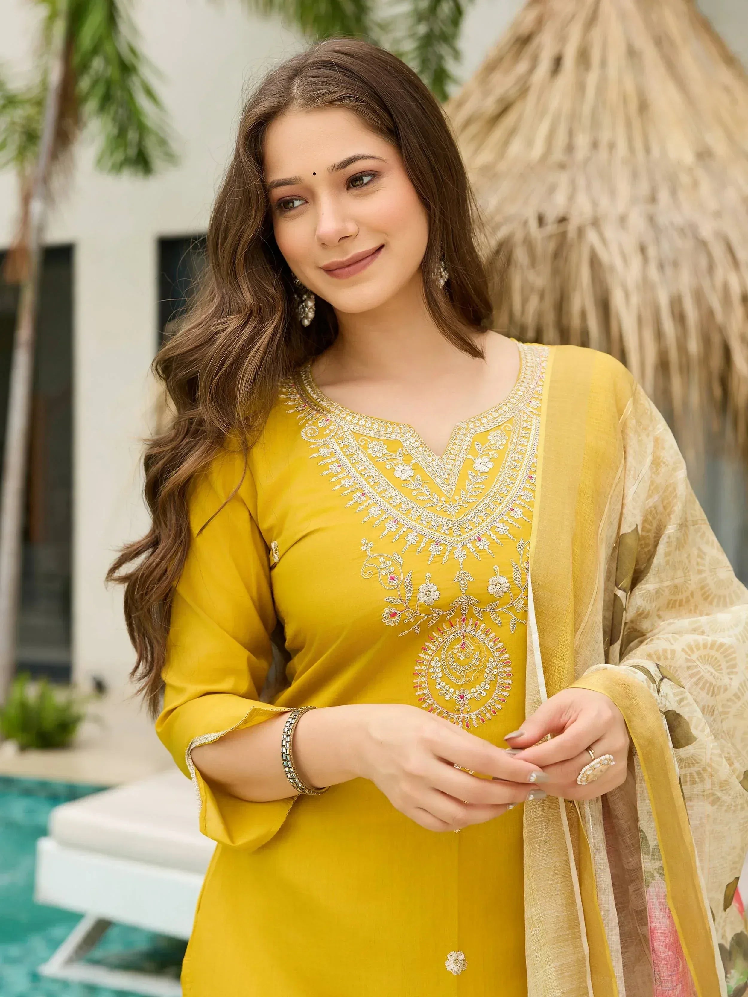 Yellow embroidered ethnic kurti with floral dupatta, perfect for Indian wear occasions