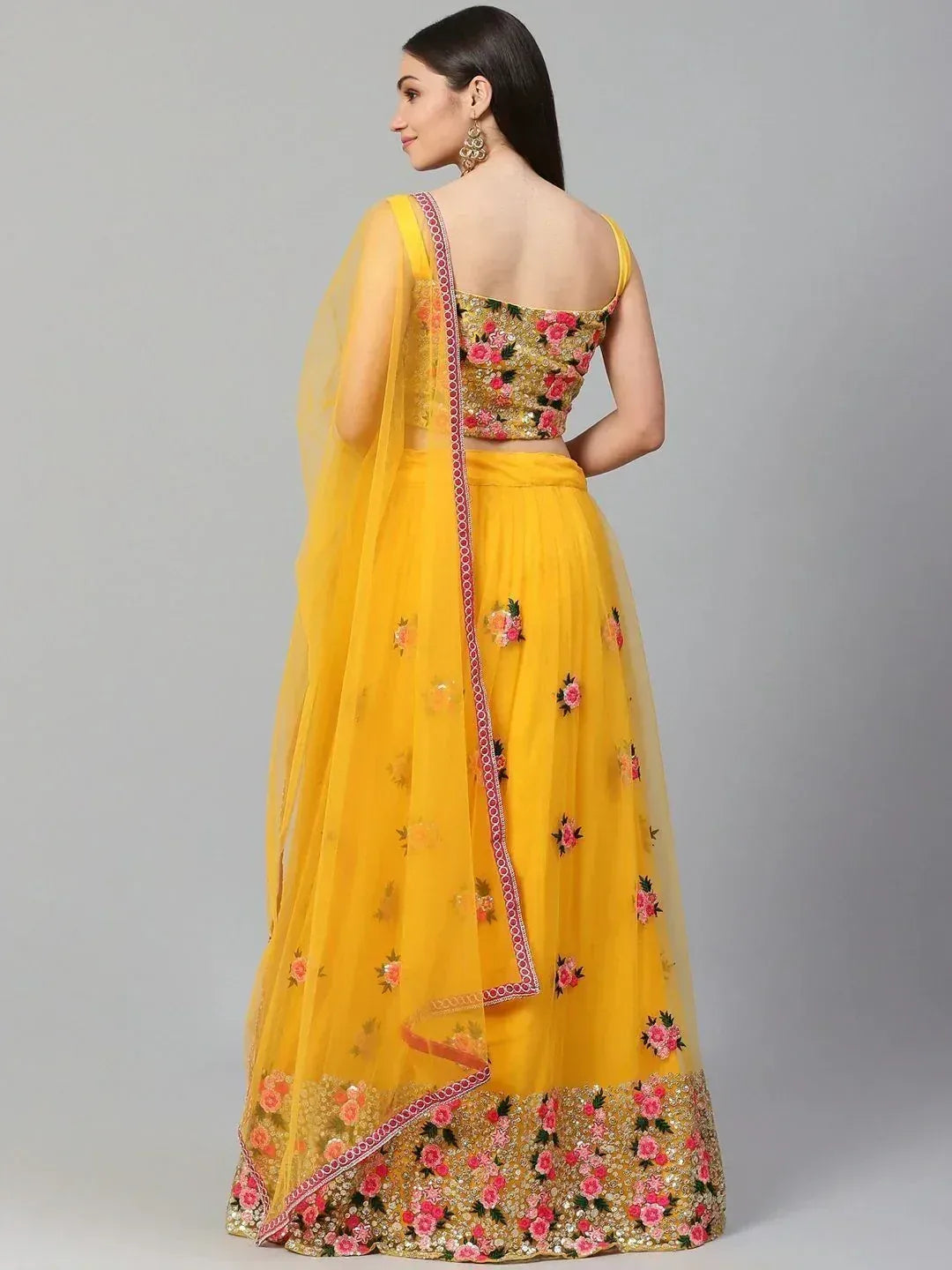 Yellow floral embroidered lehenga choli with sheer dupatta, perfect for Indian ethnic wear occasions