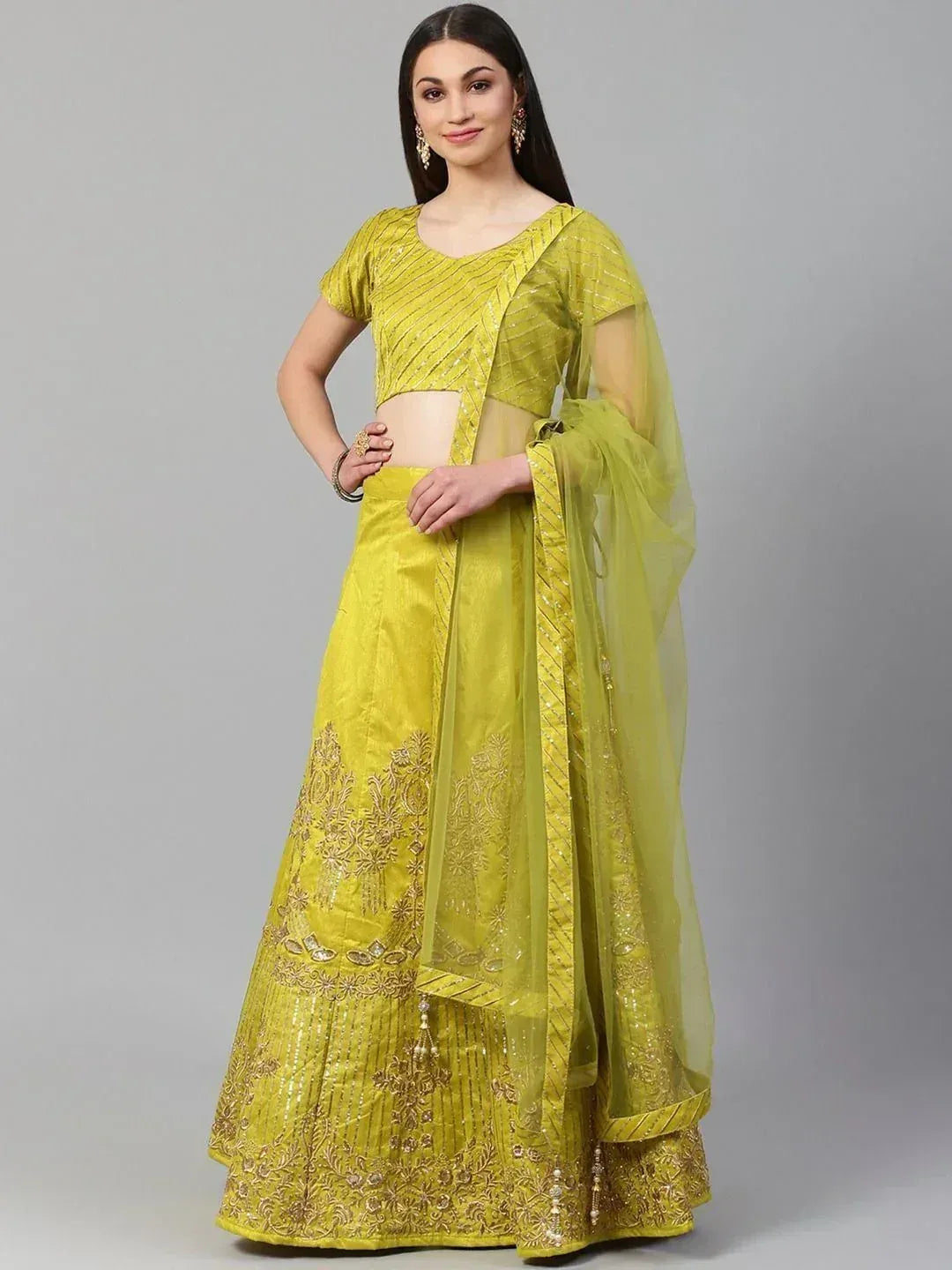 Yellow designer lehenga choli with gold embroidery and sheer dupatta, ethnic Indian wear