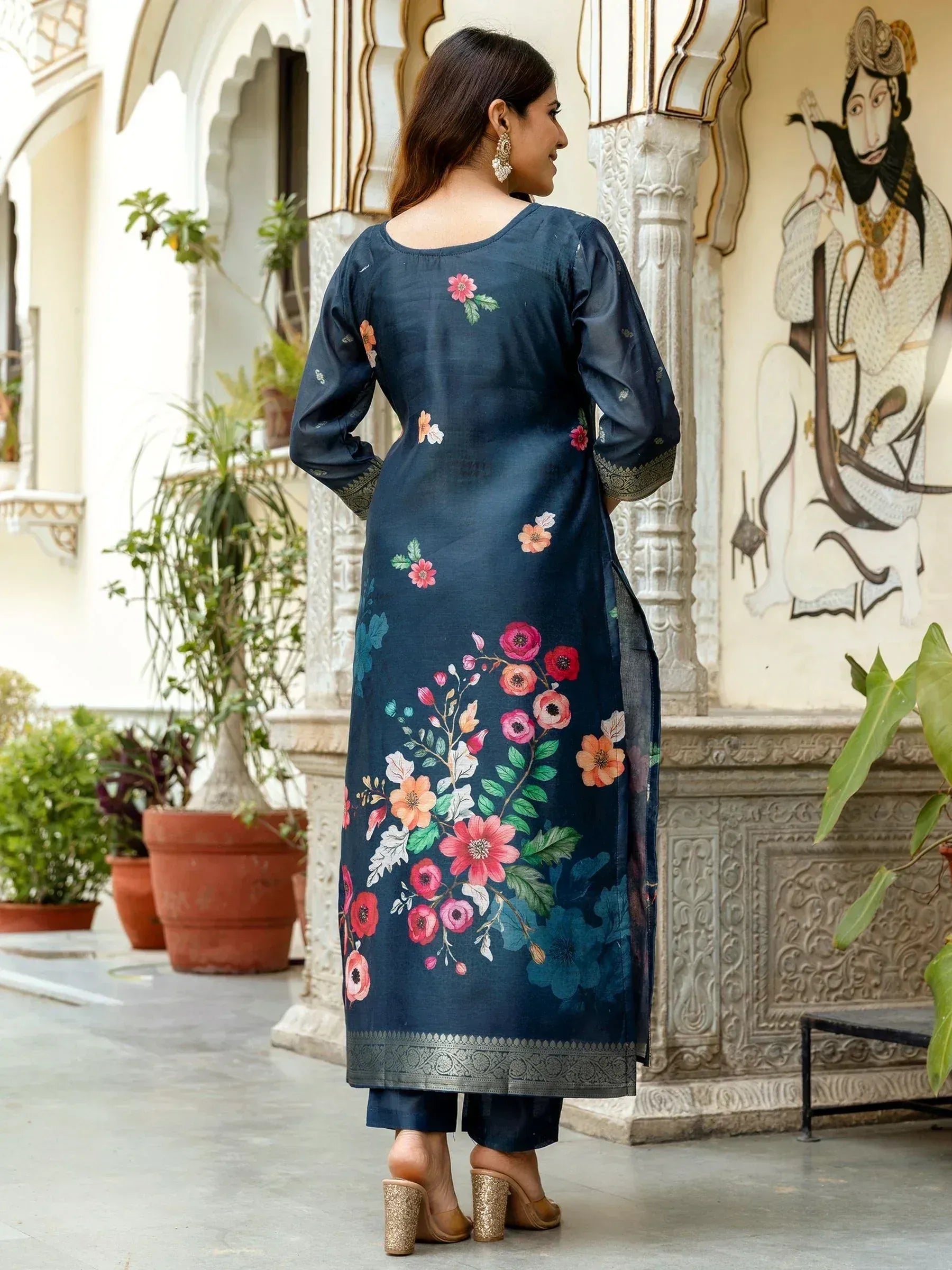 Navy blue floral printed kurta with ethnic embroidery, paired with matching pants, ideal for Indian ethnic wear.