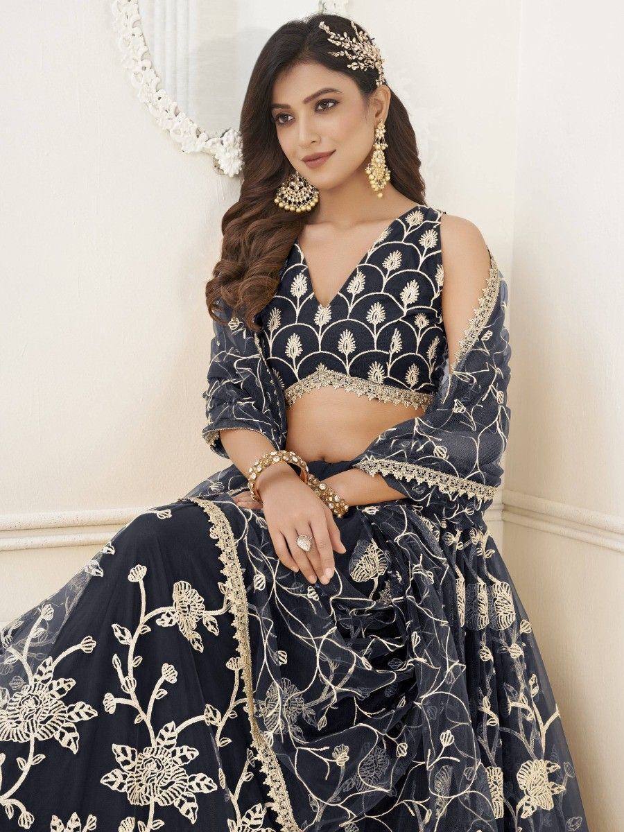 Navy blue designer lehenga choli with gold floral embroidery, perfect for Indian ethnic wear occasions.