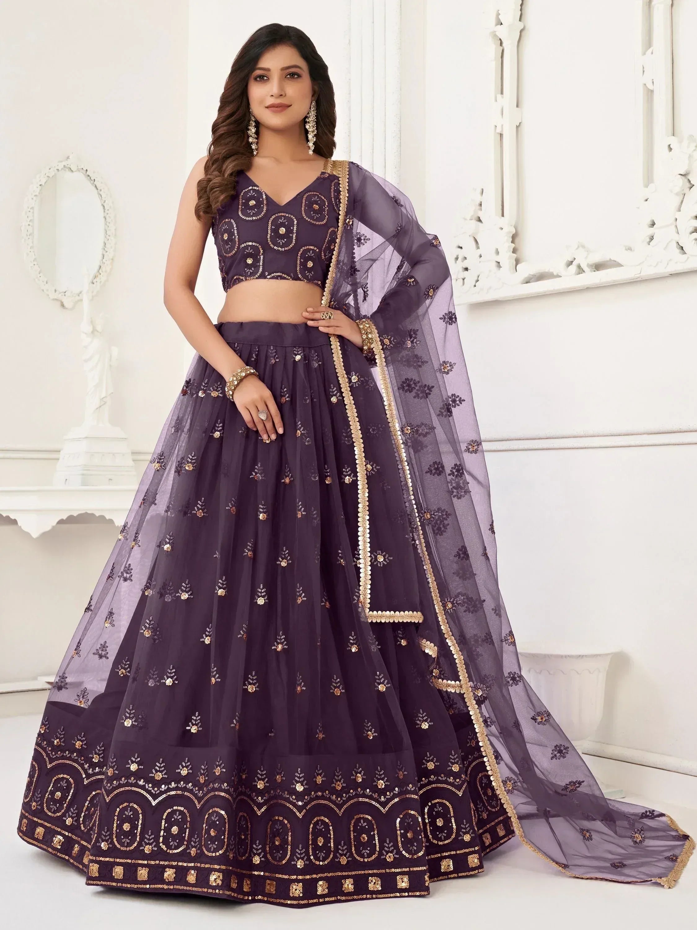 Purple designer lehenga choli with gold embroidery and sheer dupatta, perfect for Indian ethnic occasions