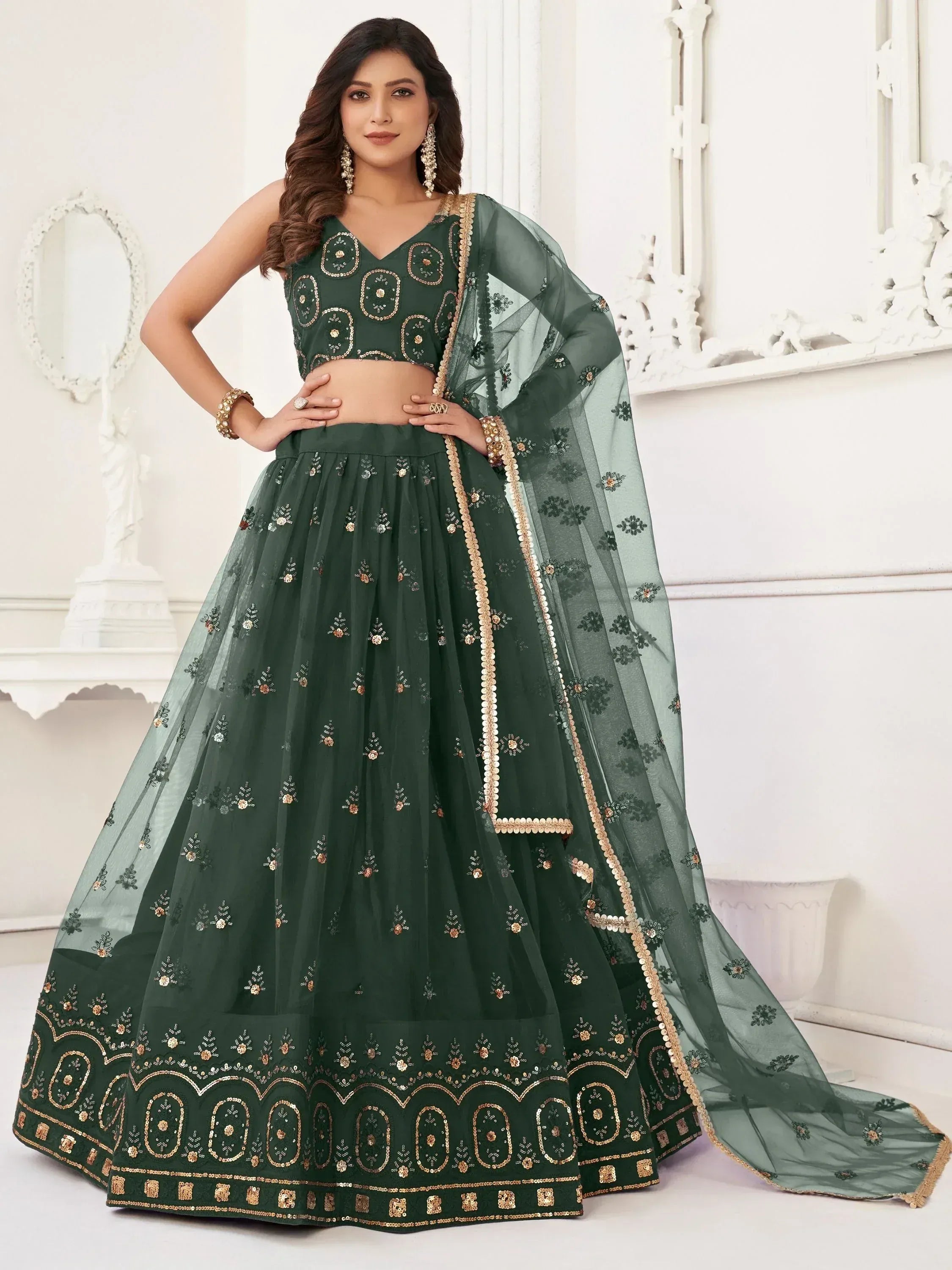Emerald green designer lehenga choli with gold embroidery and sheer dupatta for Indian ethnic wear