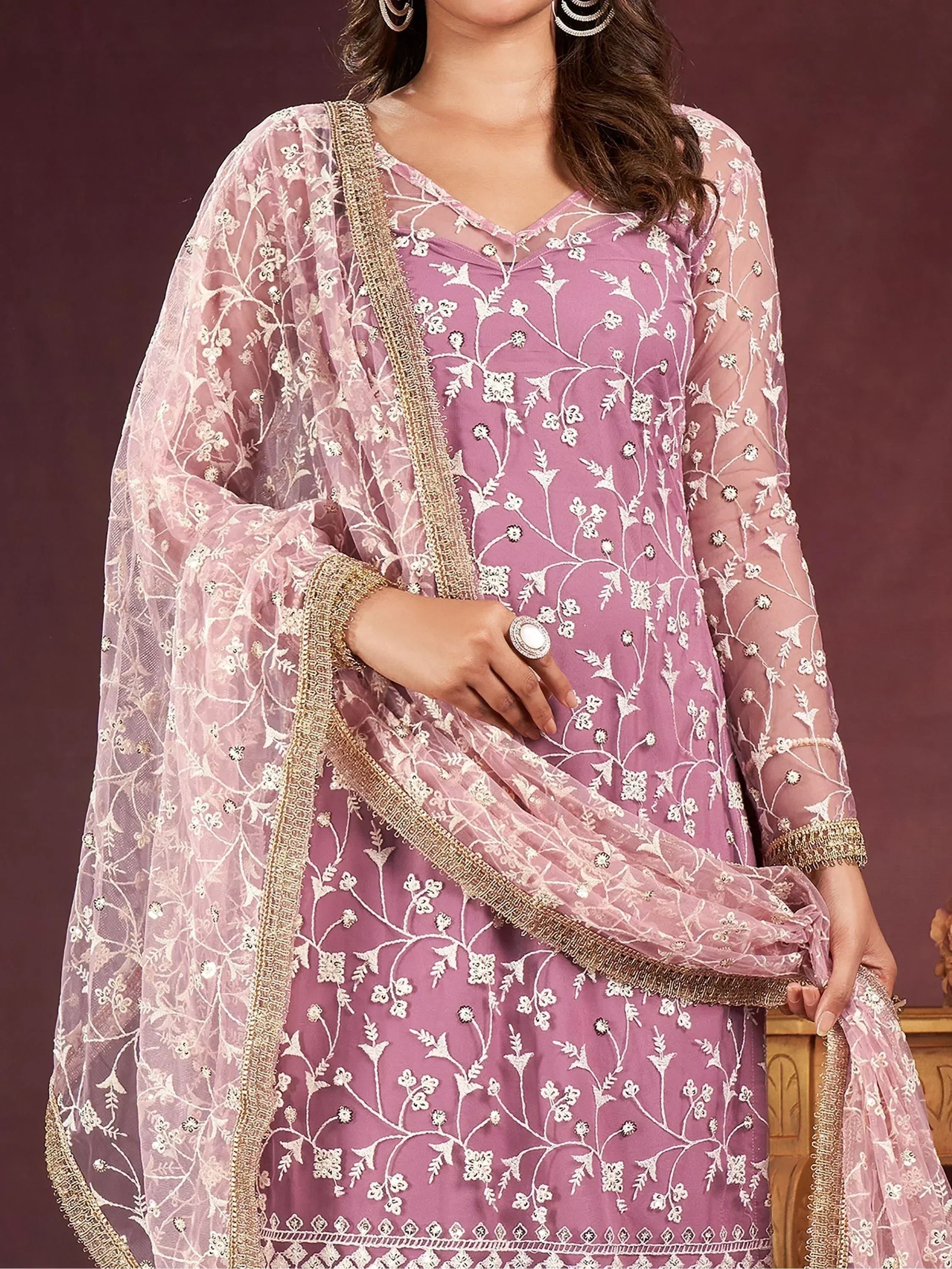 Elegant purple embroidered salwar kameez with floral detailing and gold trim