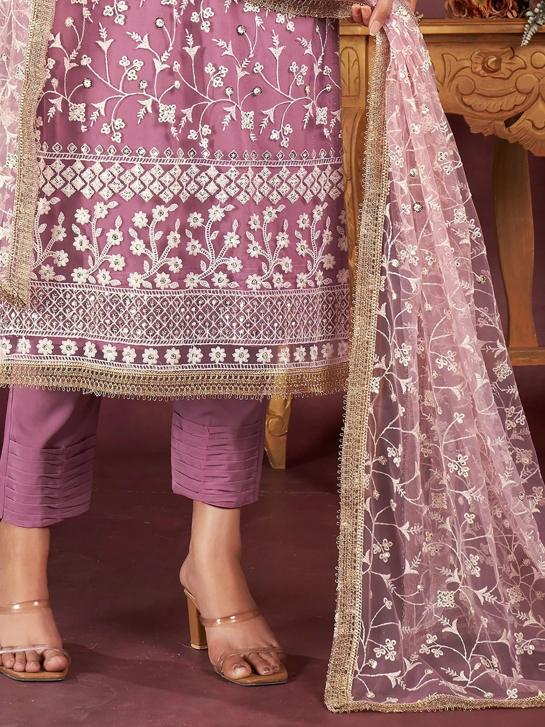 Elegant purple salwar kameez with white floral embroidery and gold trim, paired with matching dupatta.