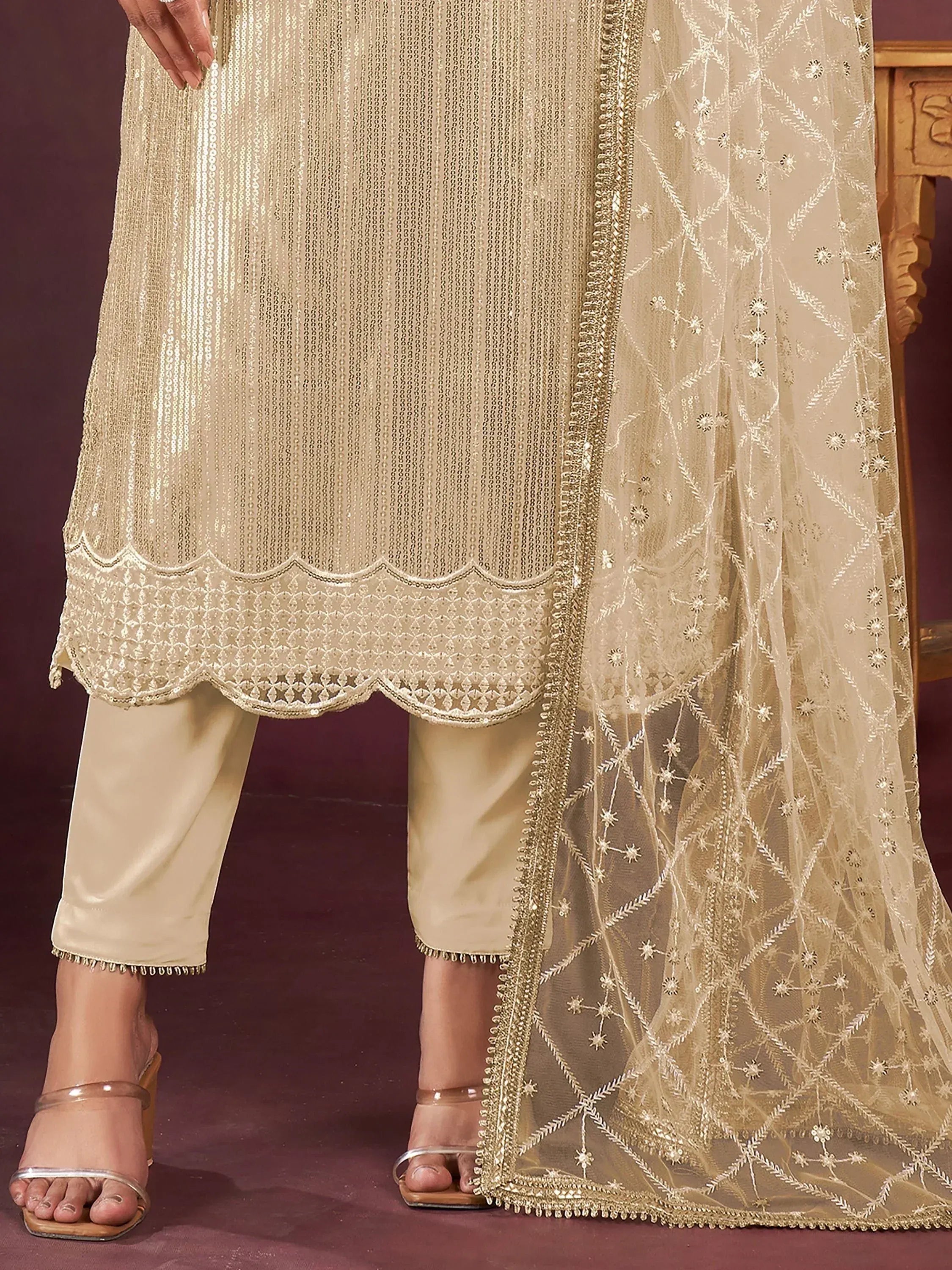 Beige sequin kurta with scalloped hem, matching pants, and embroidered dupatta for ethnic wear