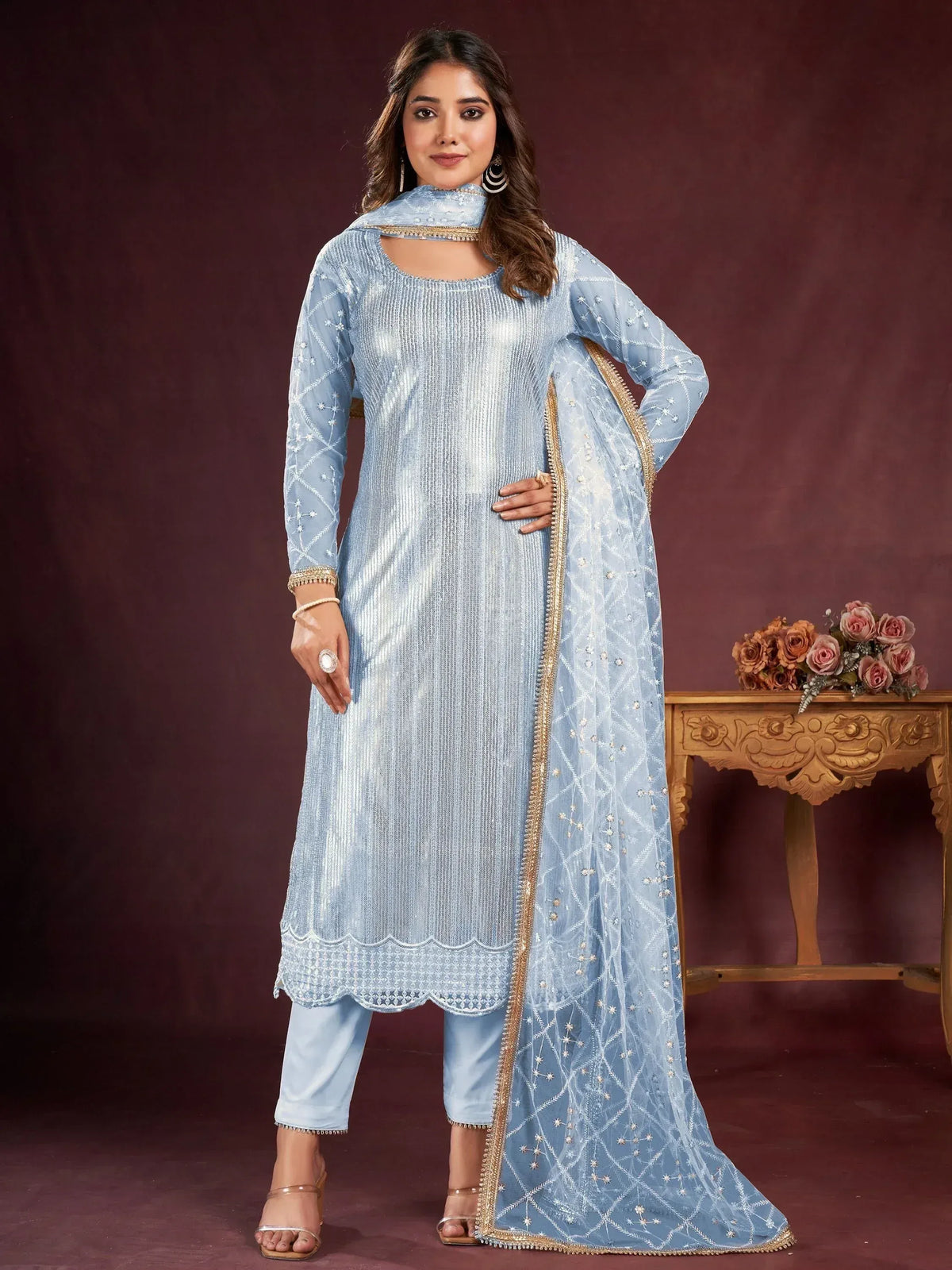 Light blue embroidered salwar kameez with scalloped hem and matching dupatta, perfect for ethnic occasions.