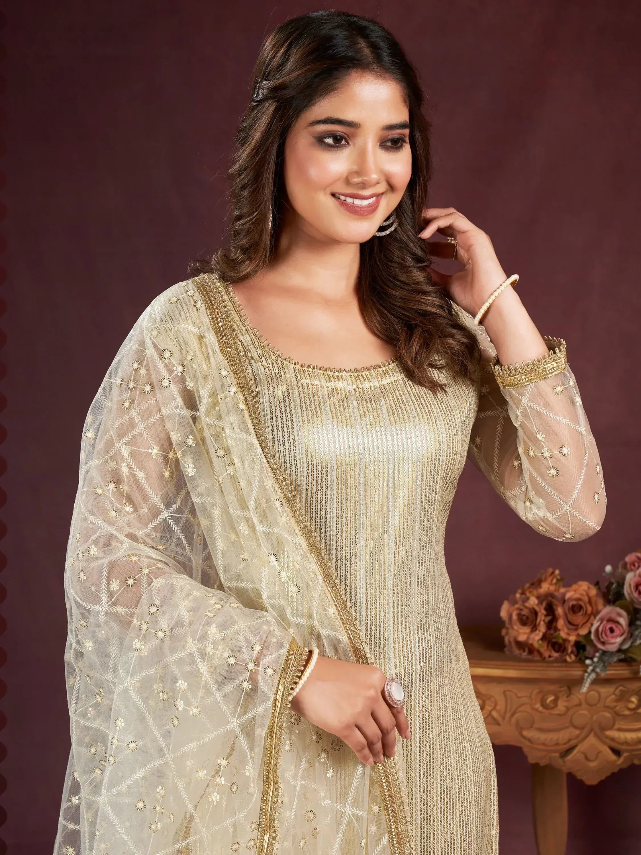Elegant gold embroidered ethnic kurta with sheer dupatta, perfect for festive occasions and weddings.