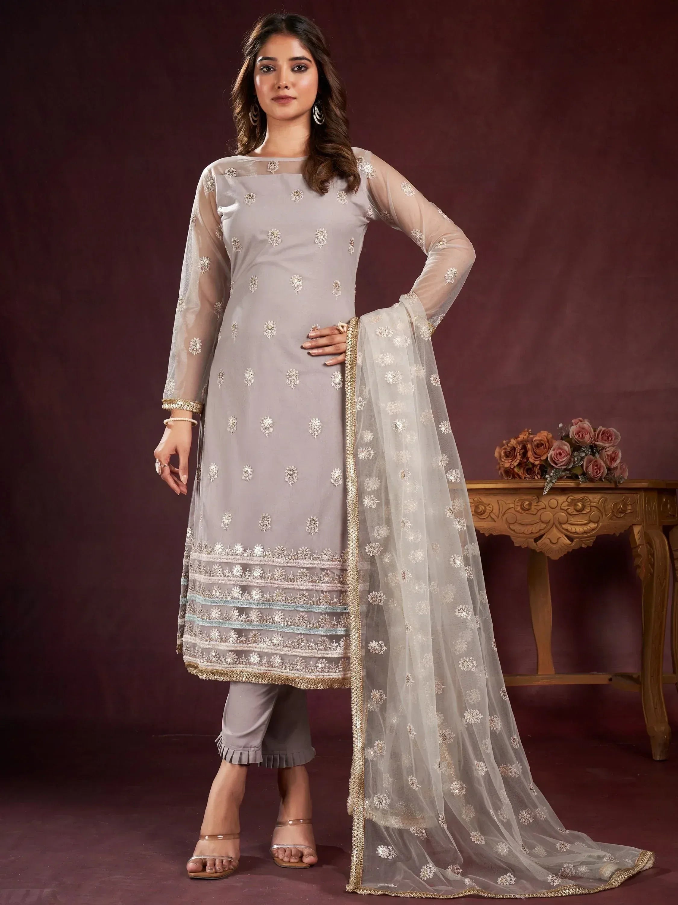 Elegant grey embroidered salwar kameez with sheer dupatta, perfect for Indian ethnic wear occasions.