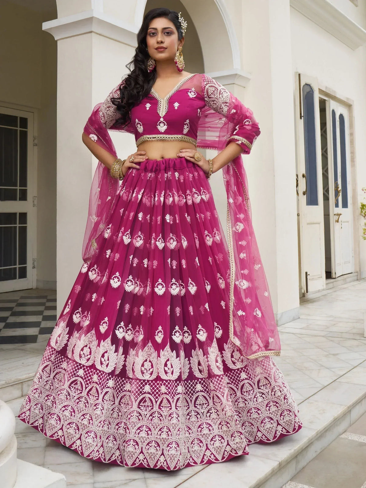 Fuchsia embroidered lehenga choli with sheer dupatta, perfect for Indian weddings and festive occasions