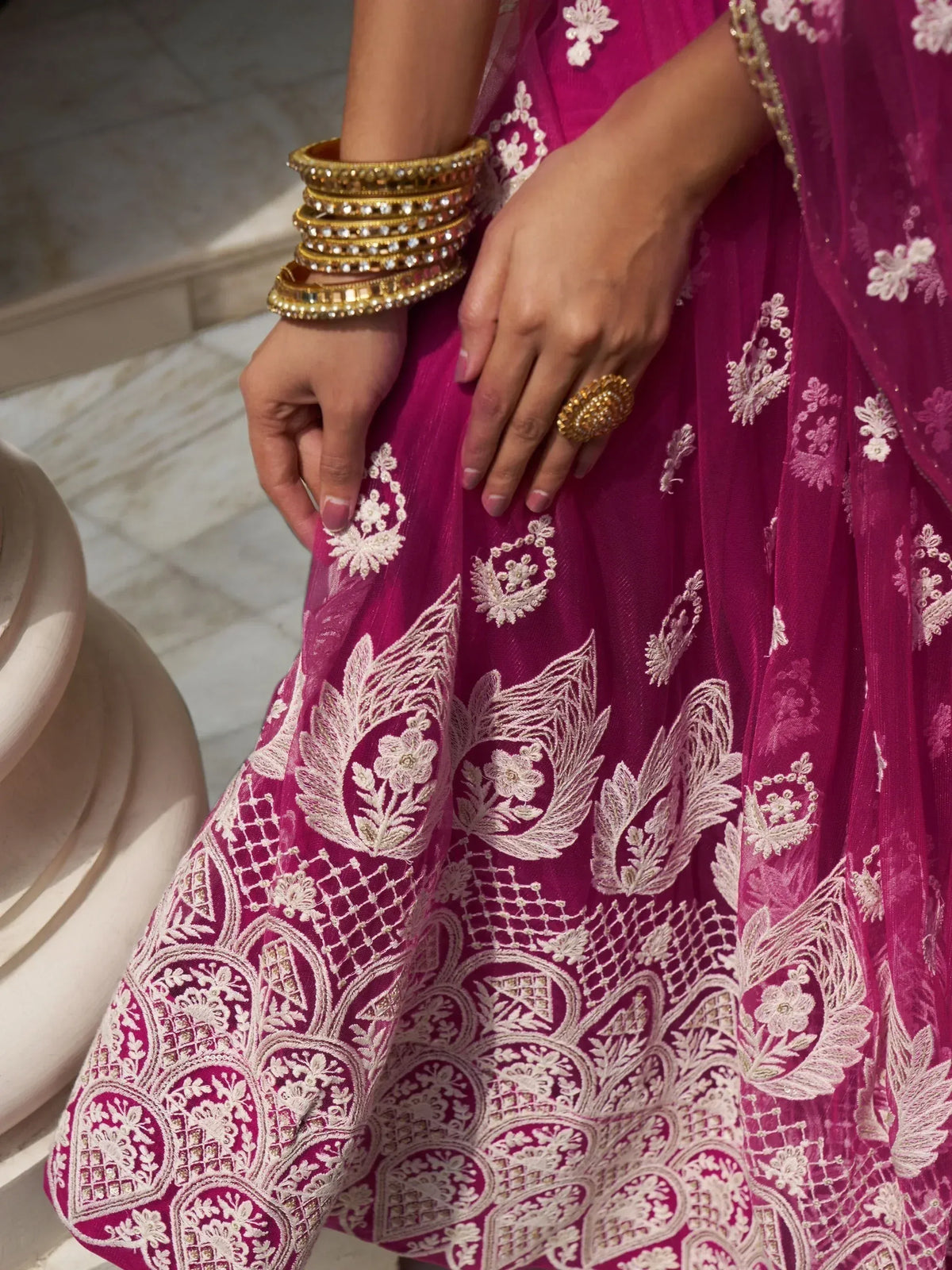Pink embroidered lehenga with gold bangles and ring, Indian ethnic wear