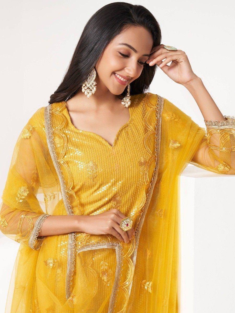 Yellow embroidered ethnic gown with sheer sleeves and gold detailing, perfect for Indian festive wear