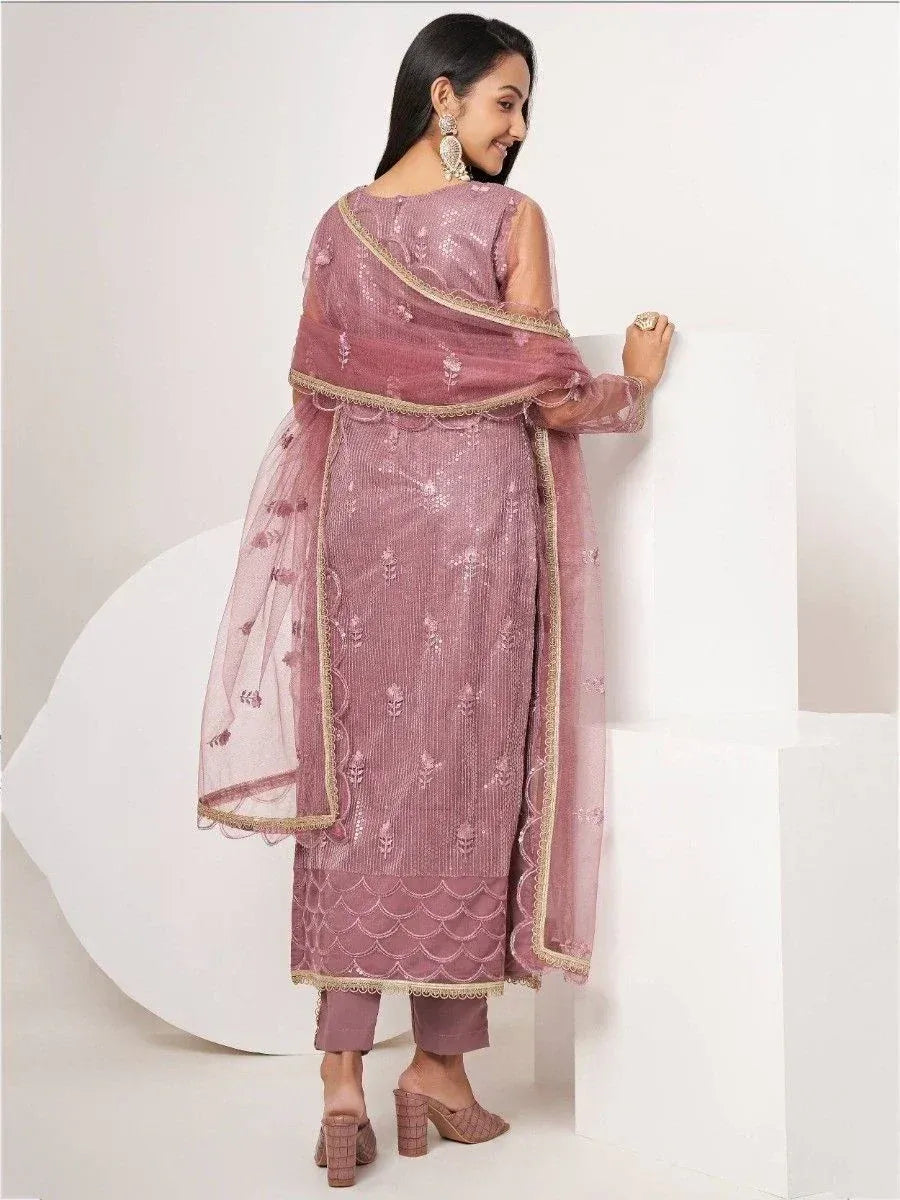 Elegant mauve ethnic salwar kameez with gold embroidery and sheer dupatta, perfect for festive occasions.