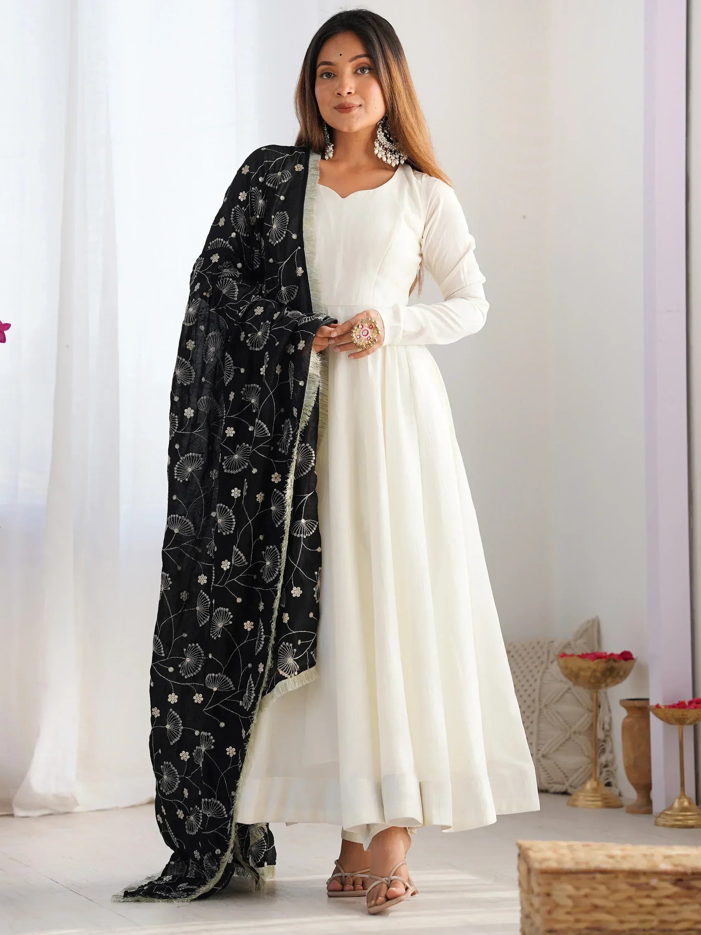 White ethnic gown with black floral dupatta, perfect for Indian occasions