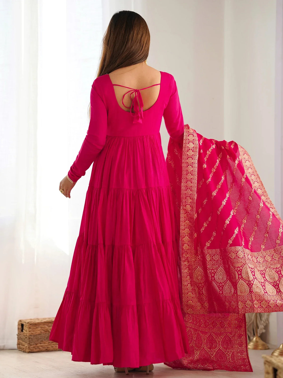 Fuchsia tiered ethnic gown with gold brocade dupatta, back view