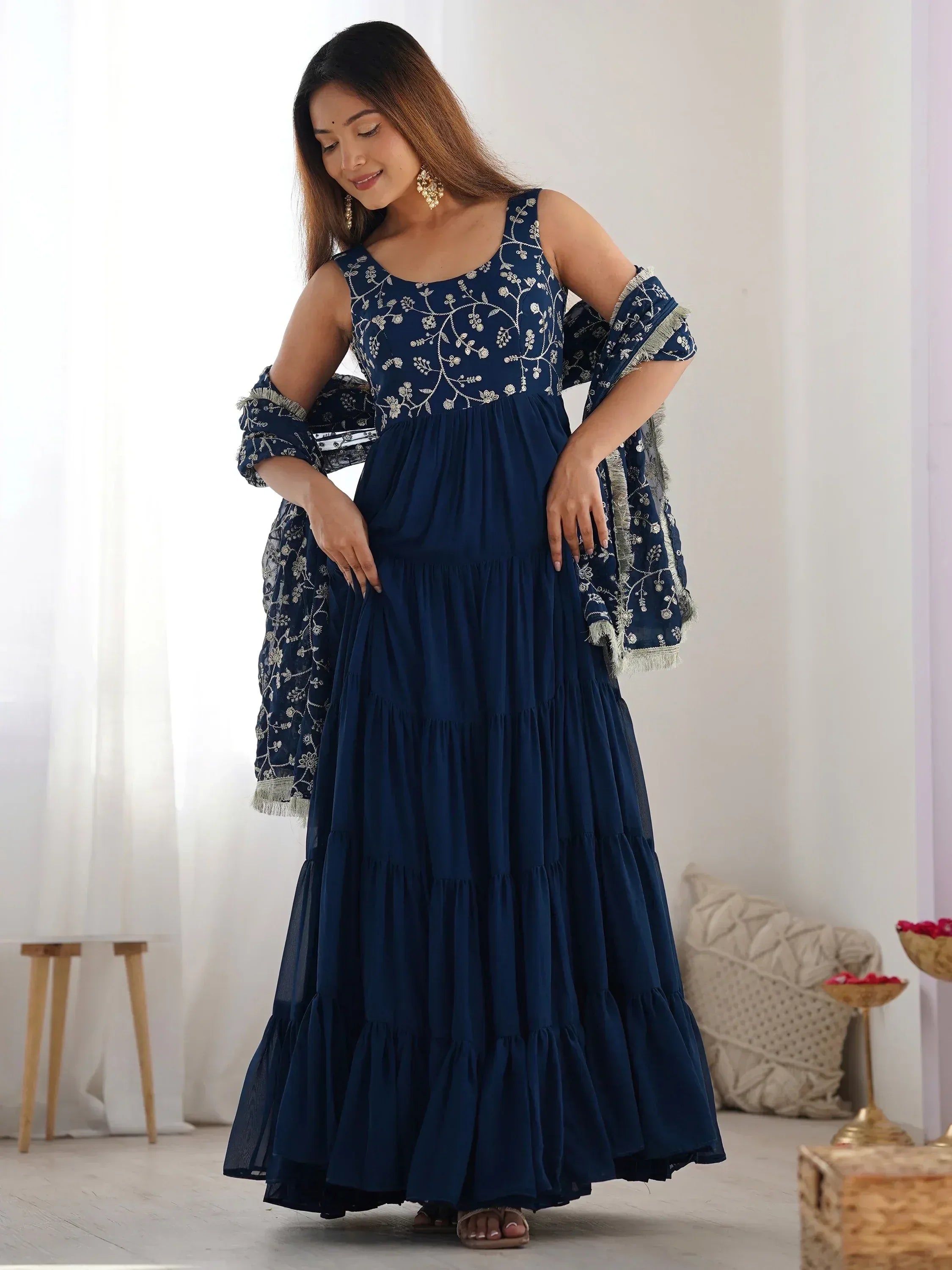 Woman in navy blue embroidered ethnic gown with matching dupatta, elegant Indian party wear