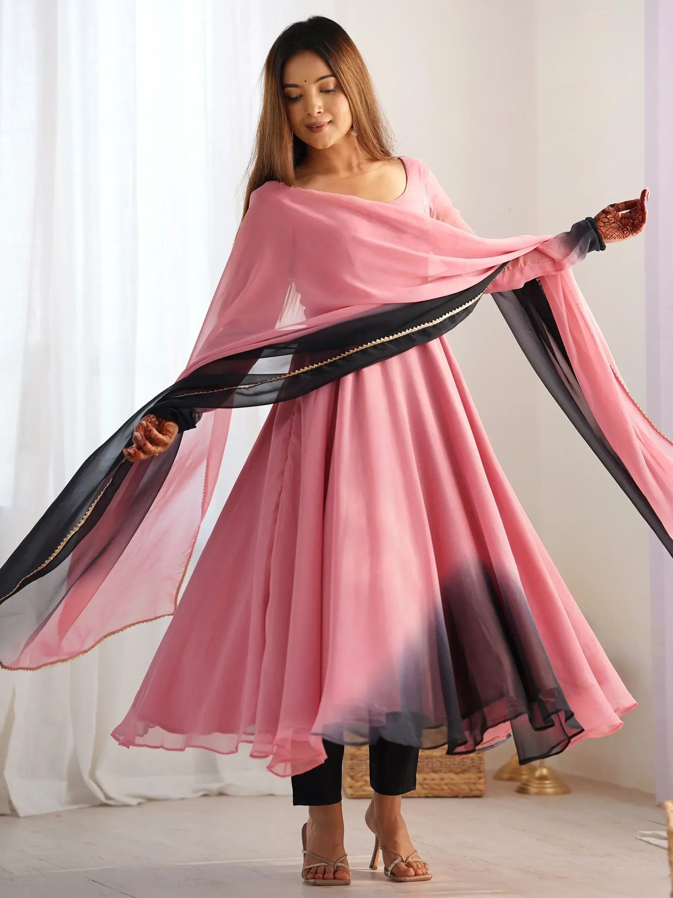 Pink and black ombre ethnic gown with flowing dupatta, perfect for Indian festive wear
