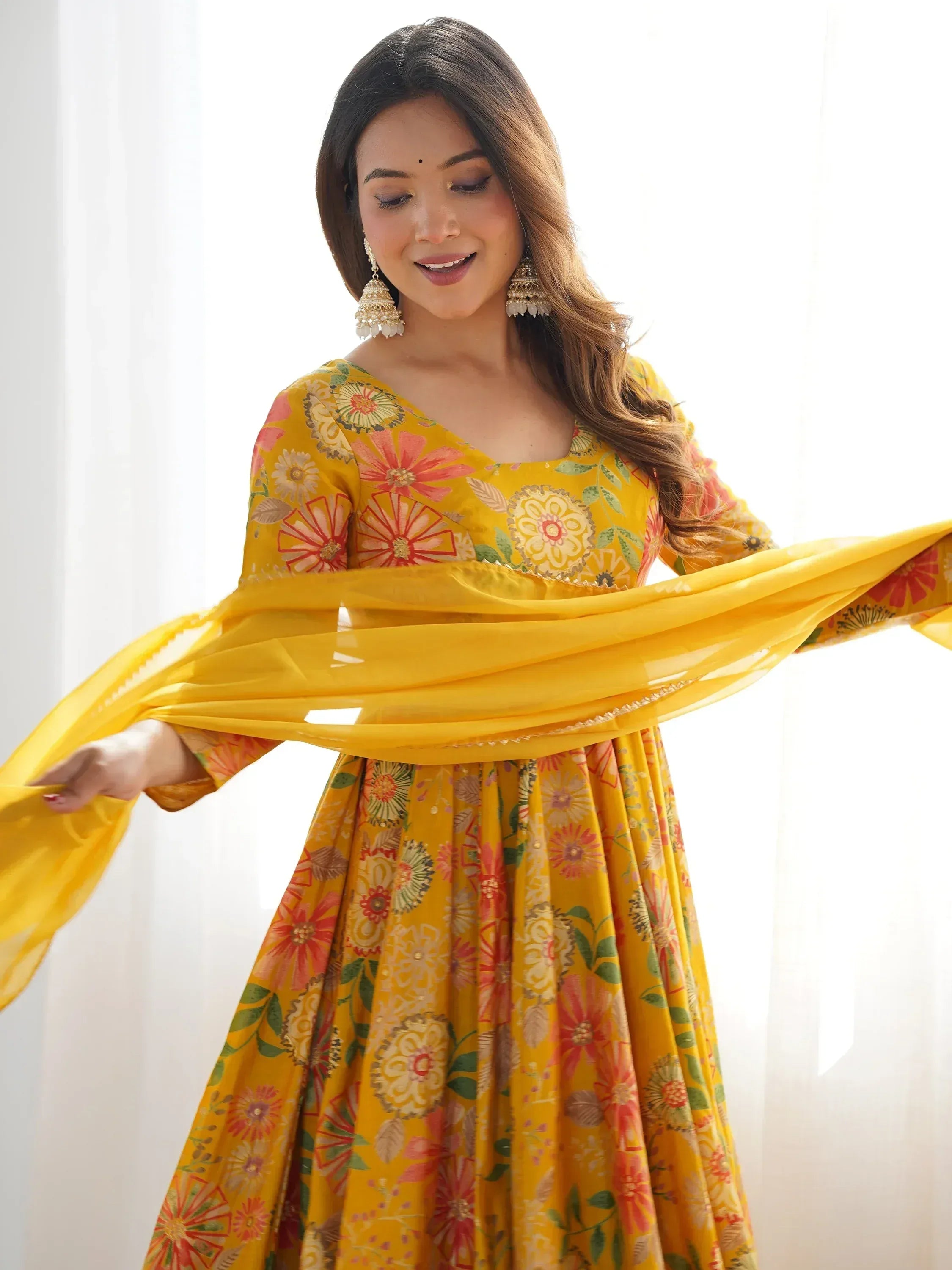 Yellow floral print Indian ethnic anarkali suit with dupatta, perfect for festive occasions and celebrations.
