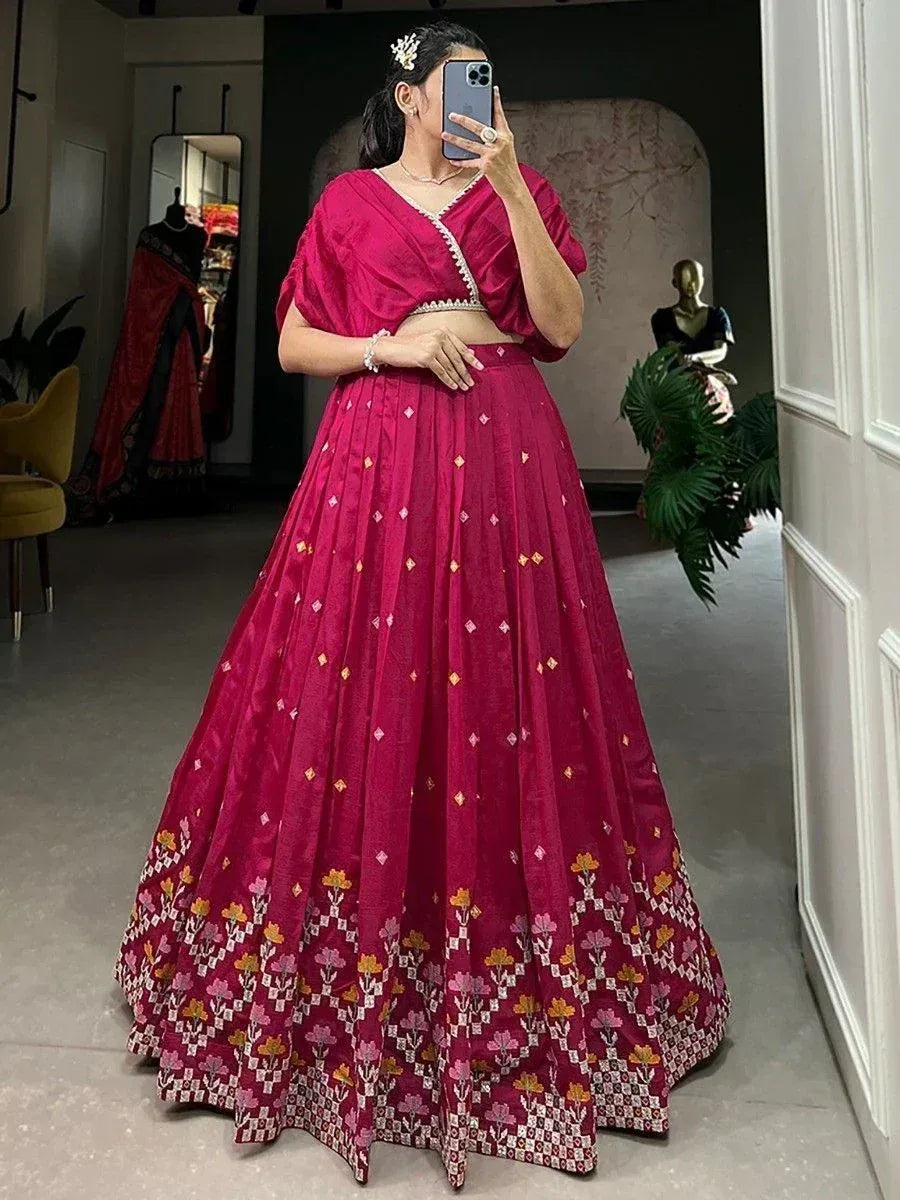 Pink embroidered lehenga choli with floral border, perfect for Indian ethnic wear occasions