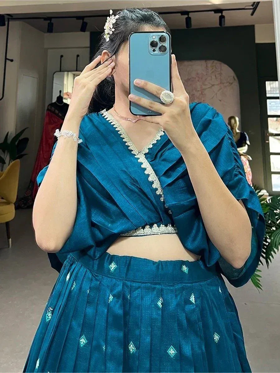 Teal blue designer lehenga choli with silver embroidery, perfect for Indian ethnic wear occasions
