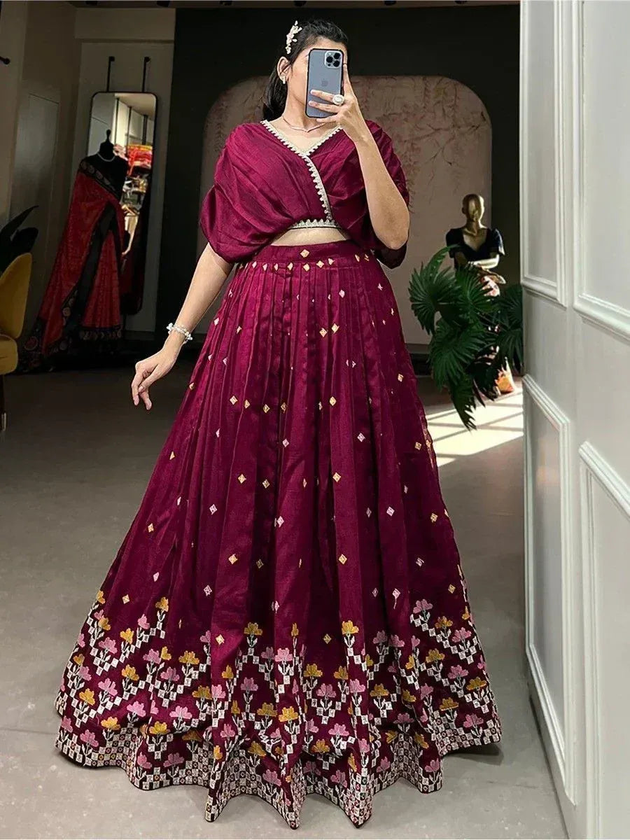 Burgundy lehenga choli with floral embroidery, perfect for Indian ethnic wear and festive occasions.