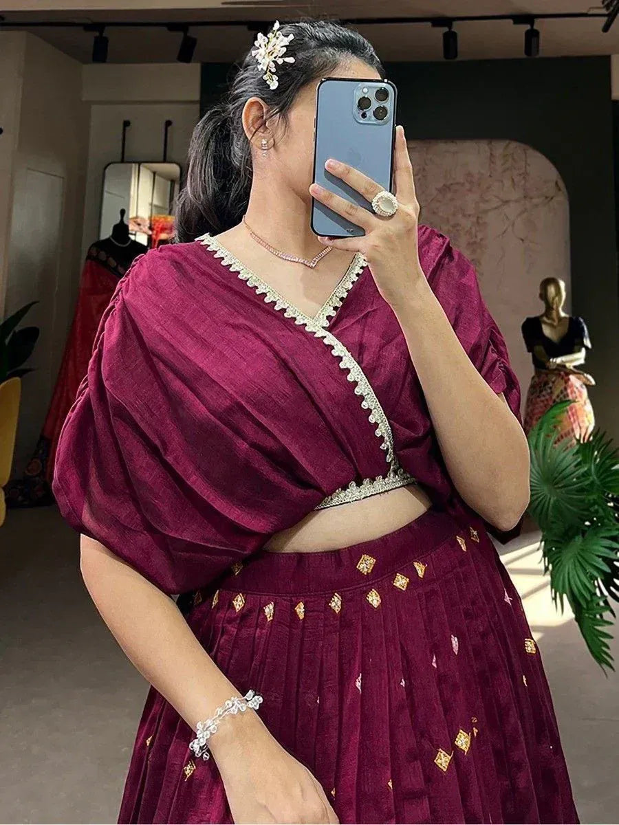 Maroon ethnic lehenga choli with gold embroidery, puff sleeves, and V-neck blouse for women