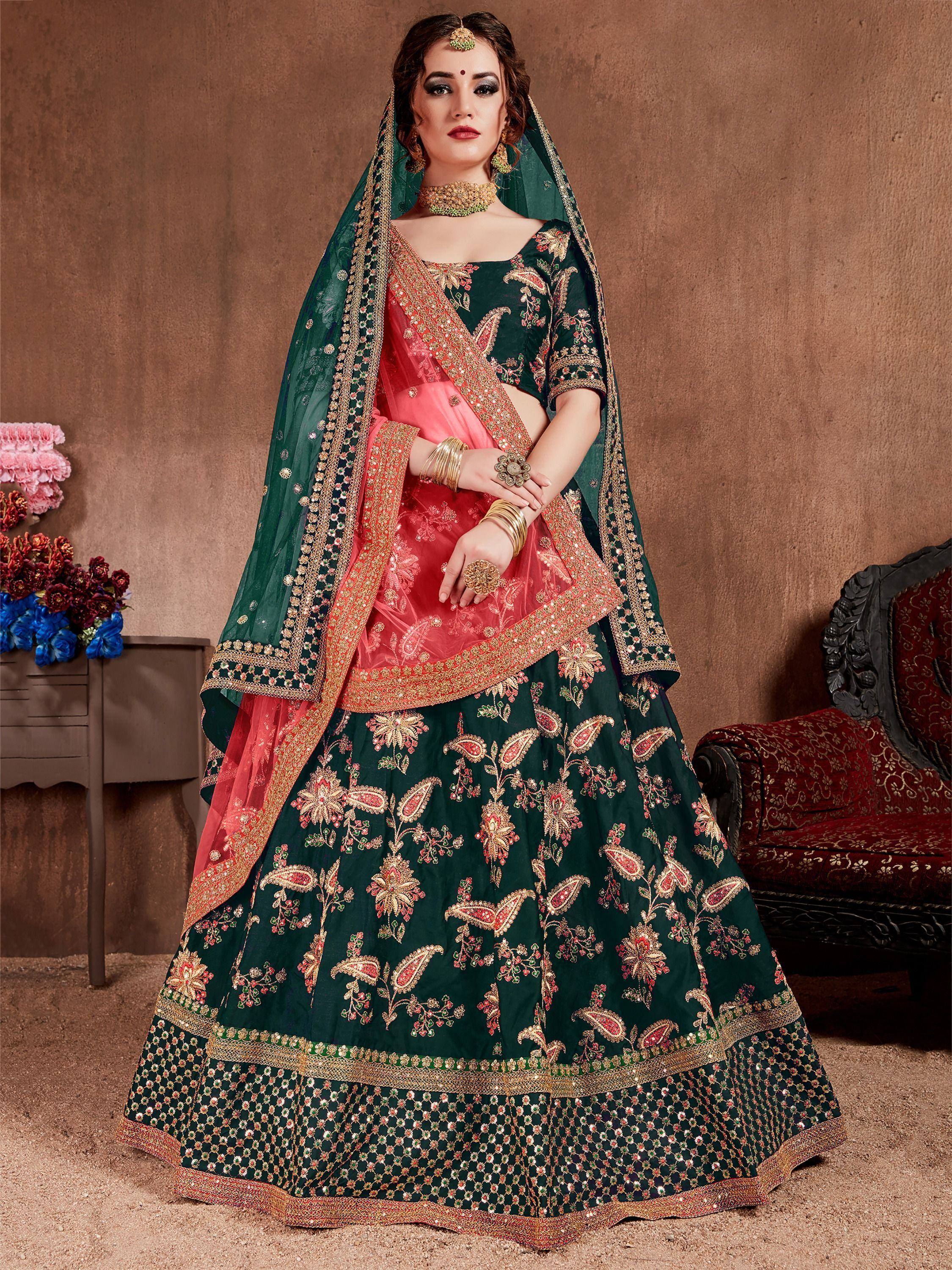 Emerald green and pink embroidered lehenga choli with dupatta, perfect for Indian weddings and festive occasions.