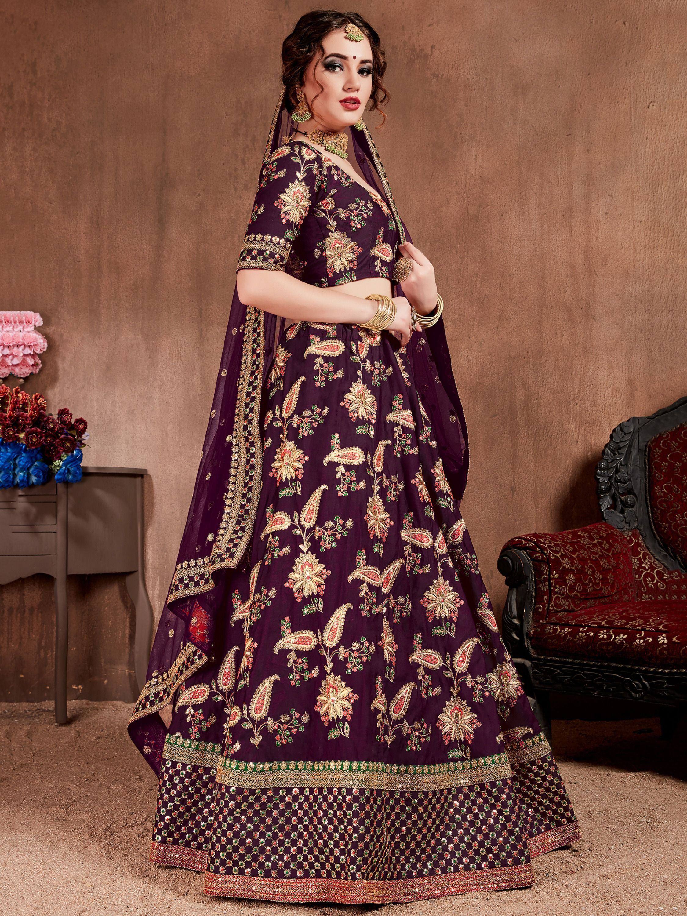 Elegant purple lehenga choli with floral embroidery, perfect for Indian weddings and festive occasions.