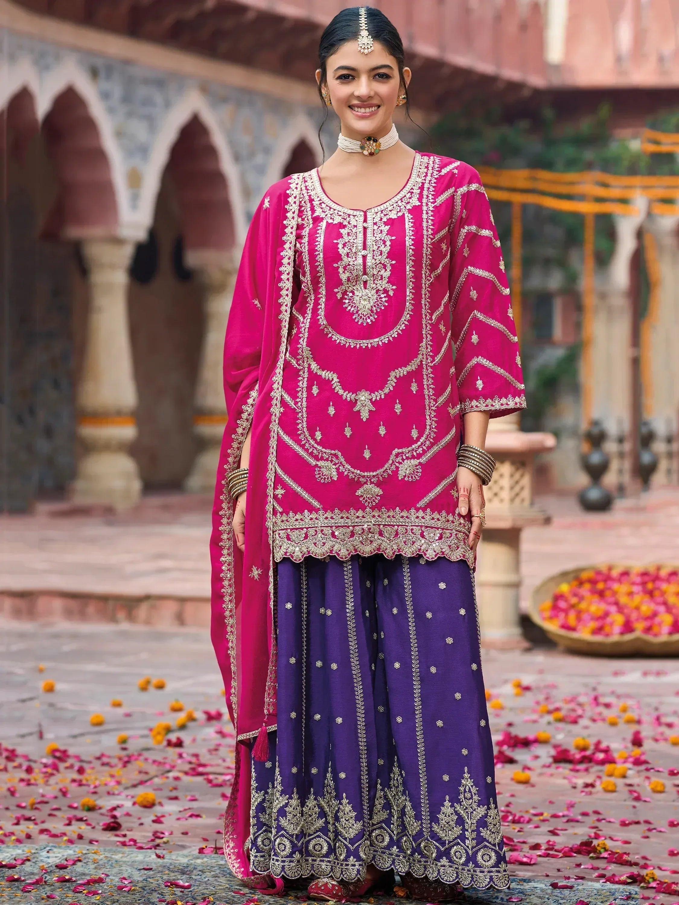 Pink and purple embroidered Indian ethnic salwar kameez with gold detailing, perfect for festive occasions