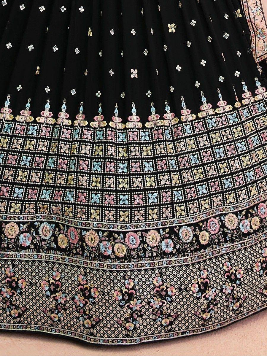 Black lehenga with colorful floral embroidery and mirror work, perfect for Indian ethnic wear.