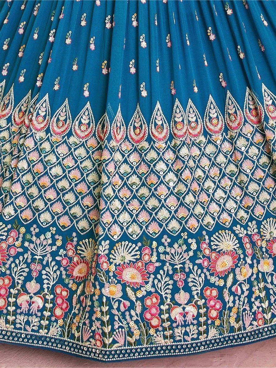 Teal lehenga skirt with intricate floral embroidery and mirror work, perfect for Indian ethnic wear