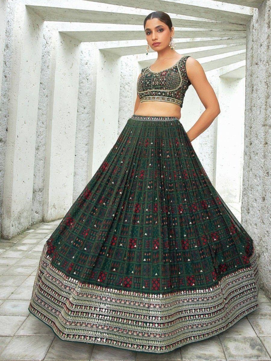 Green embroidered lehenga choli with mirror work, perfect for Indian ethnic wear and festive occasions.
