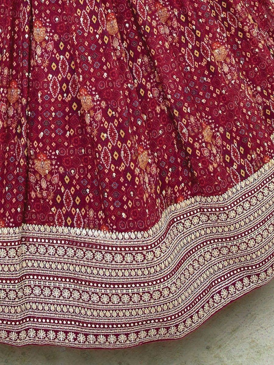 Maroon lehenga with intricate gold and white embroidery, perfect for Indian ethnic wear
