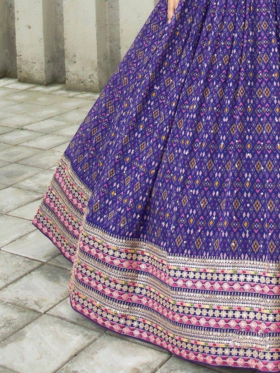 Purple ethnic lehenga with geometric print and embroidered border, ideal for Indian festive wear