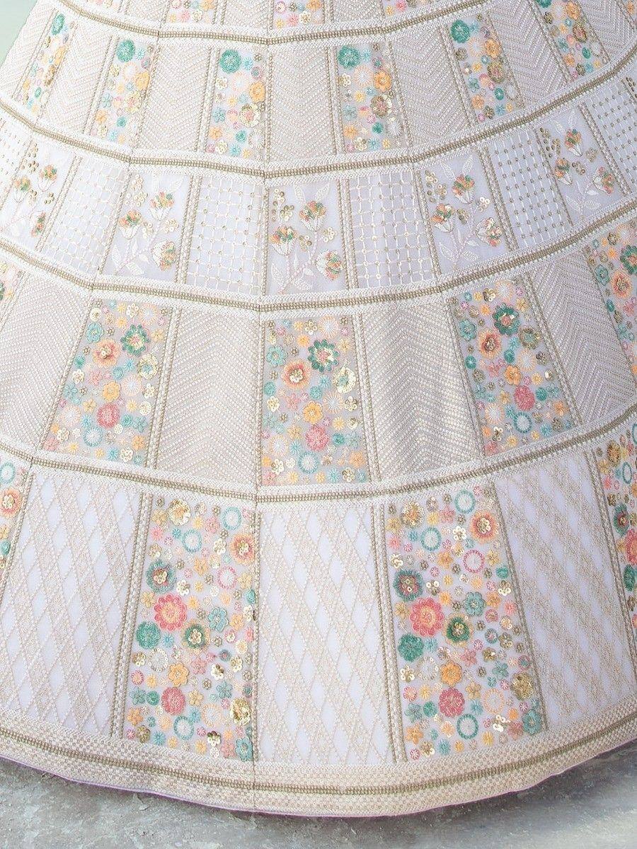 Designer lehenga skirt with floral embroidery and sequin detailing in pastel tones
