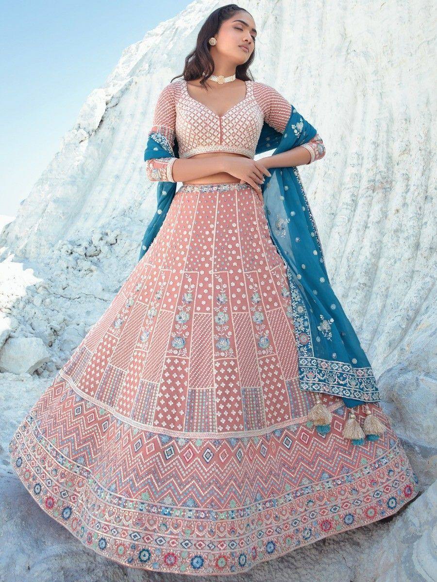 Pink embroidered lehenga choli with blue dupatta, ethnic Indian wear for weddings and festivals