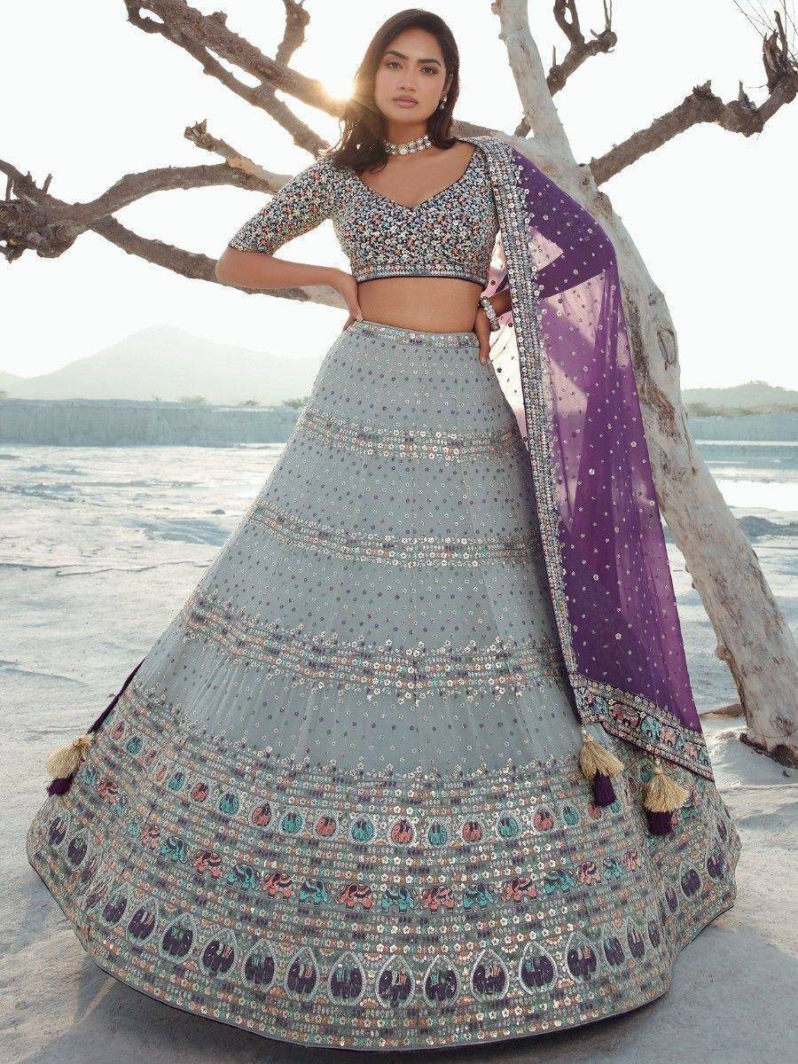 Designer lehenga choli with sequin embroidery, purple dupatta, beach sunset backdrop