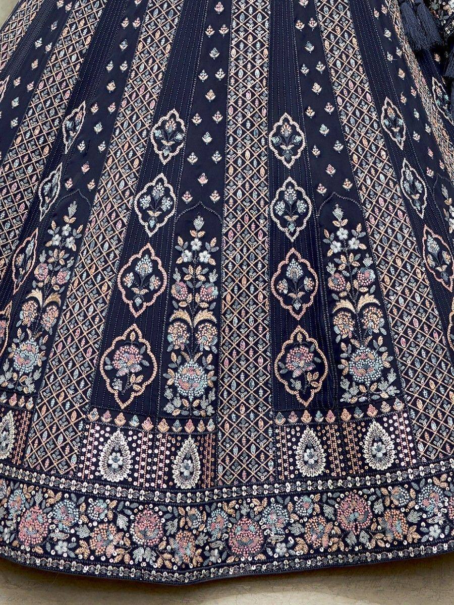 Dark blue lehenga skirt with intricate floral embroidery and sequin detailing, perfect for ethnic wear.