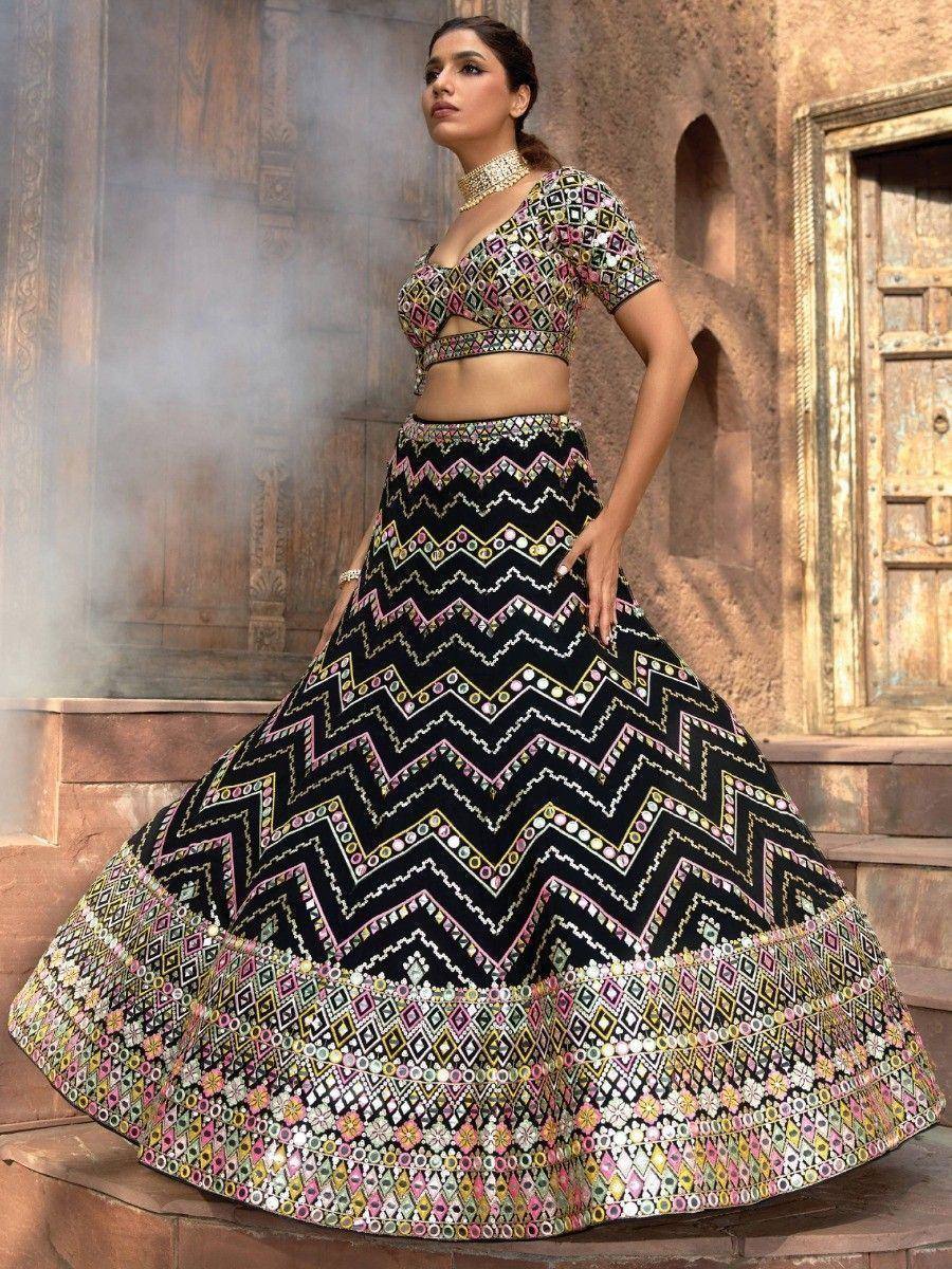 Black and pink geometric print lehenga choli with mirror work, perfect for Indian ethnic wear events