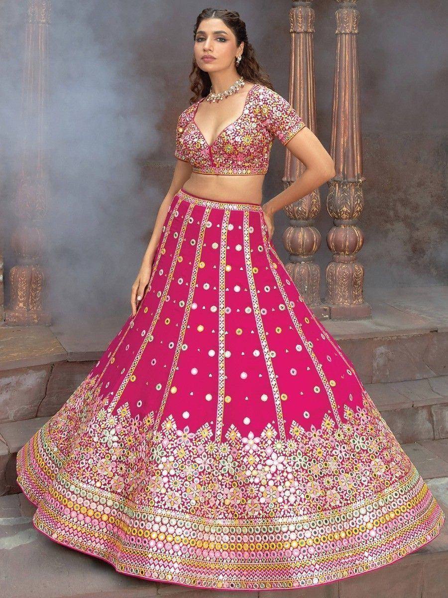 Pink floral embroidered lehenga choli with mirror work, perfect for Indian weddings and festive occasions
