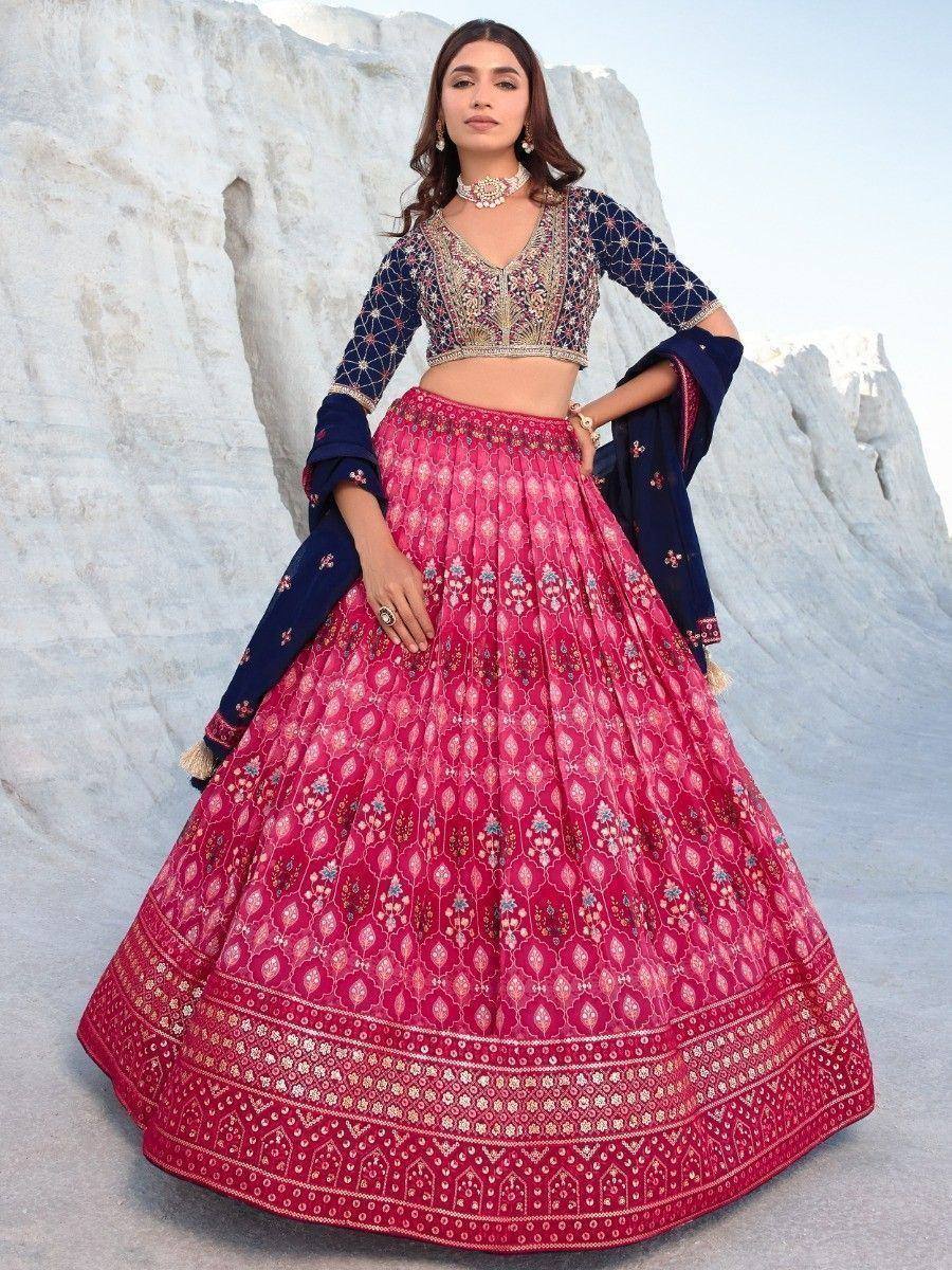 Pink and navy blue embroidered lehenga choli with intricate patterns, perfect for Indian ethnic wear occasions.