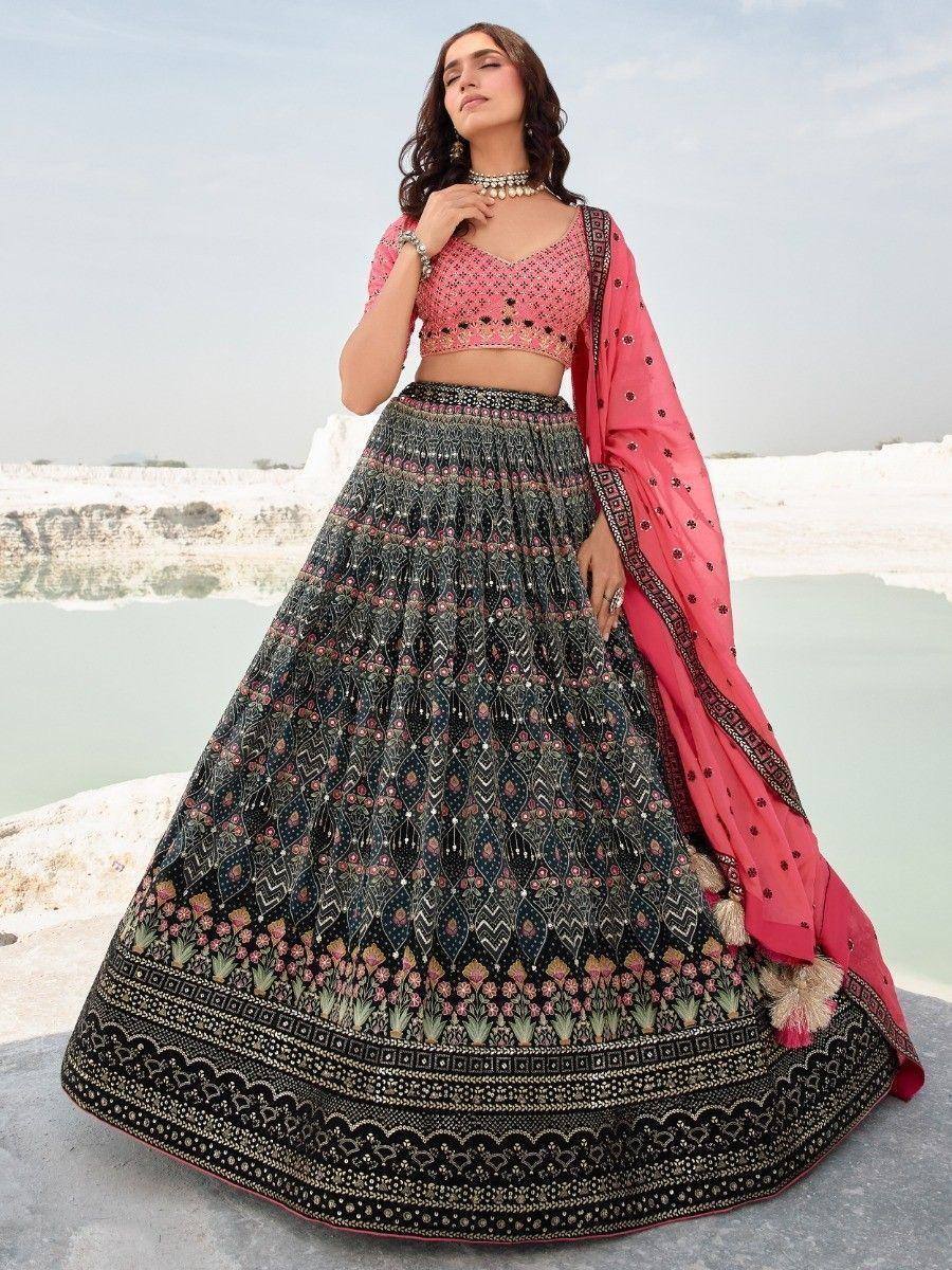 Elegant black and pink embroidered lehenga choli with floral patterns, perfect for Indian ethnic wear occasions.
