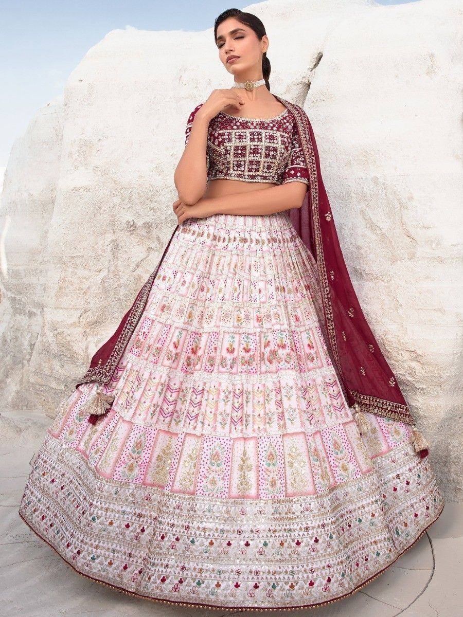 Elegant maroon and pink embroidered lehenga choli with dupatta, perfect for Indian weddings and festivals